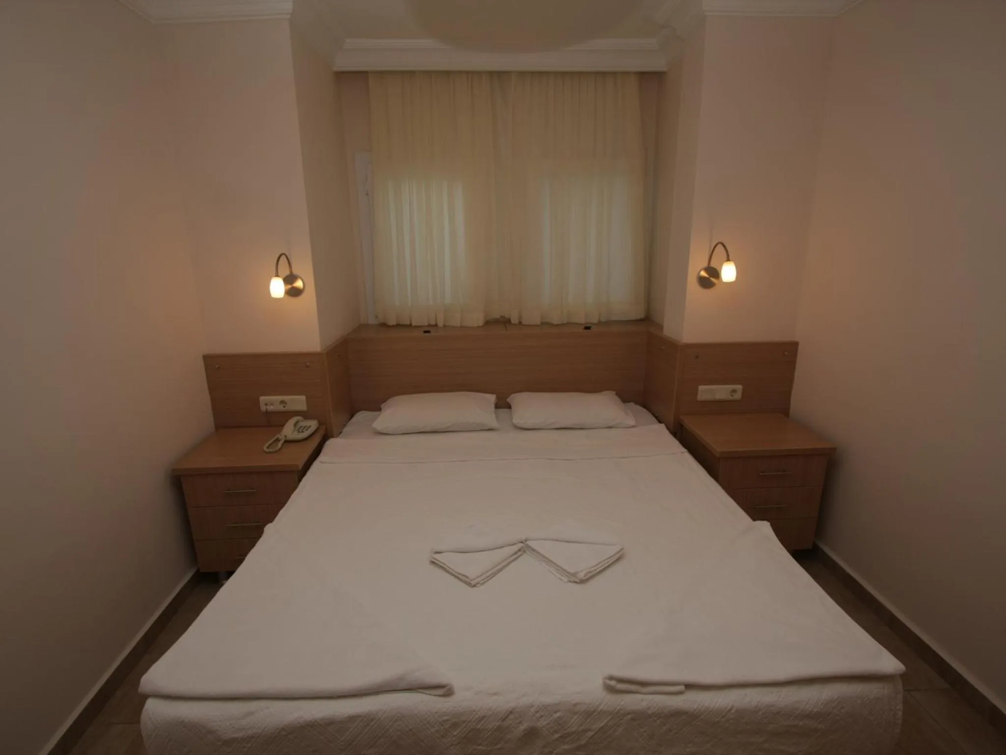 Bed in Sea Breeze Hotel and Apartments
