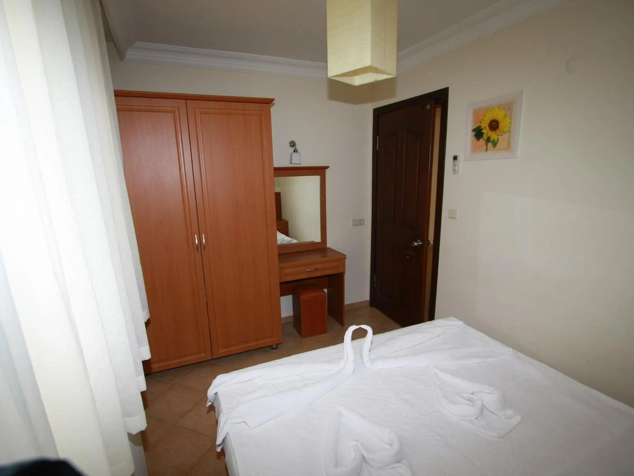 Bed in Sea Breeze Hotel and Apartments