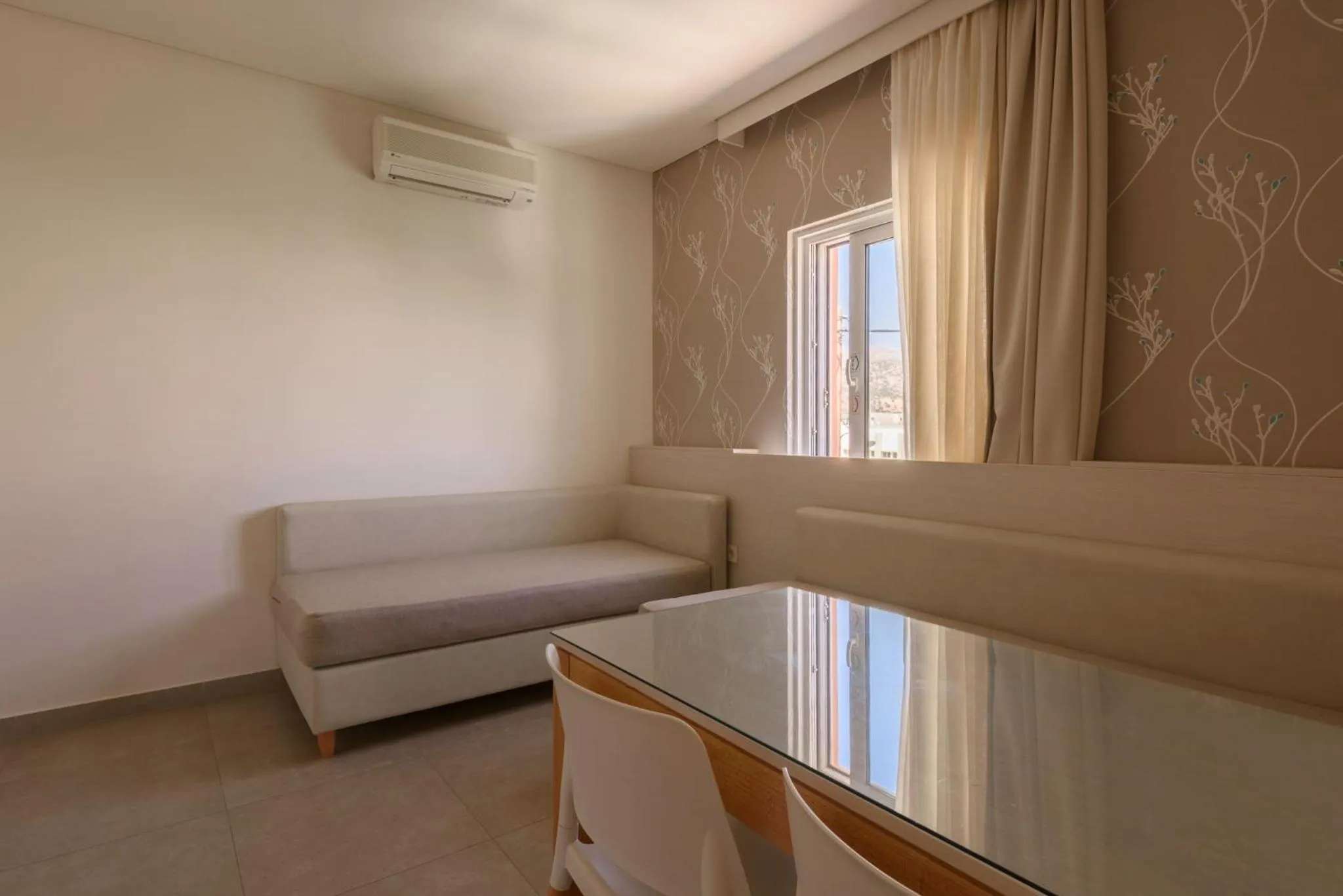 Seating area, Bed in Poseidon Studios & Apartments