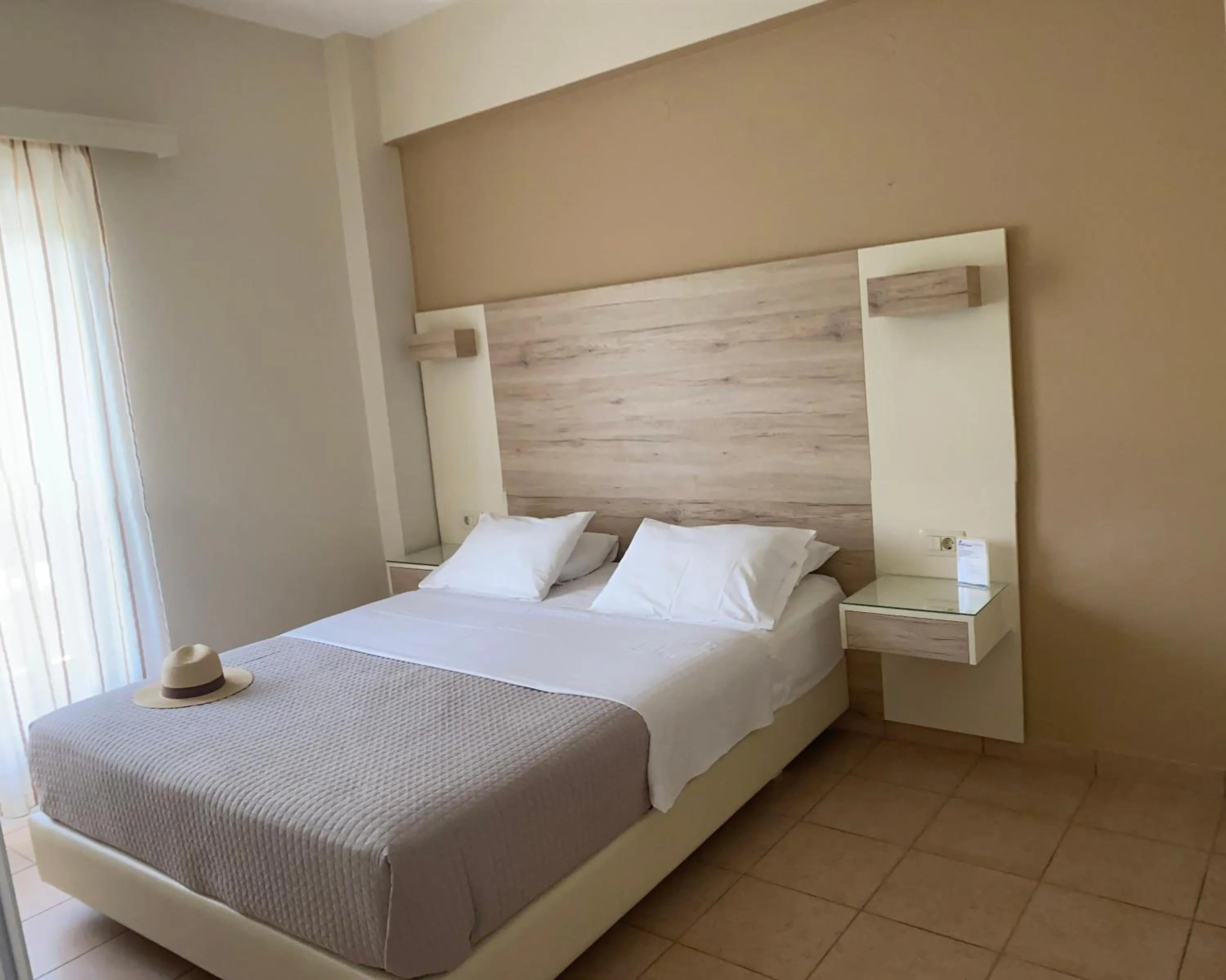 Bed in Poseidon Studios & Apartments