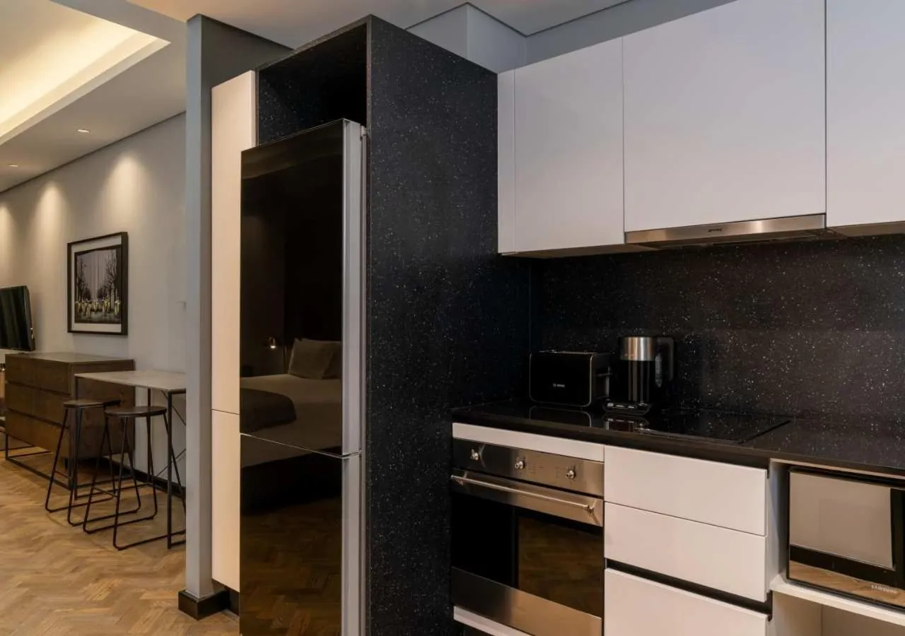 Kitchen or kitchenette in The Onyx Apartment Hotel by NEWMARK