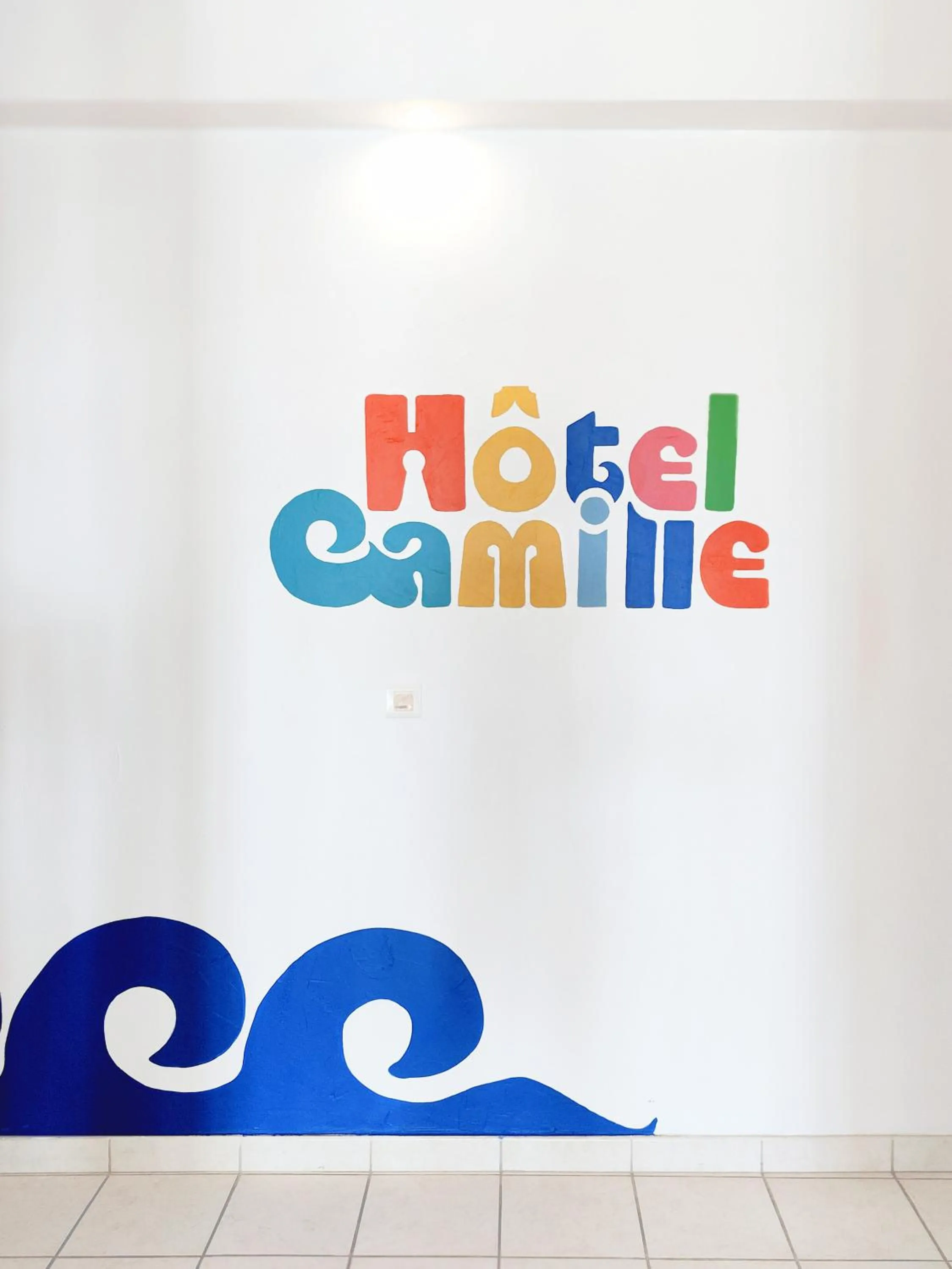 Property logo or sign in Hotel Camille
