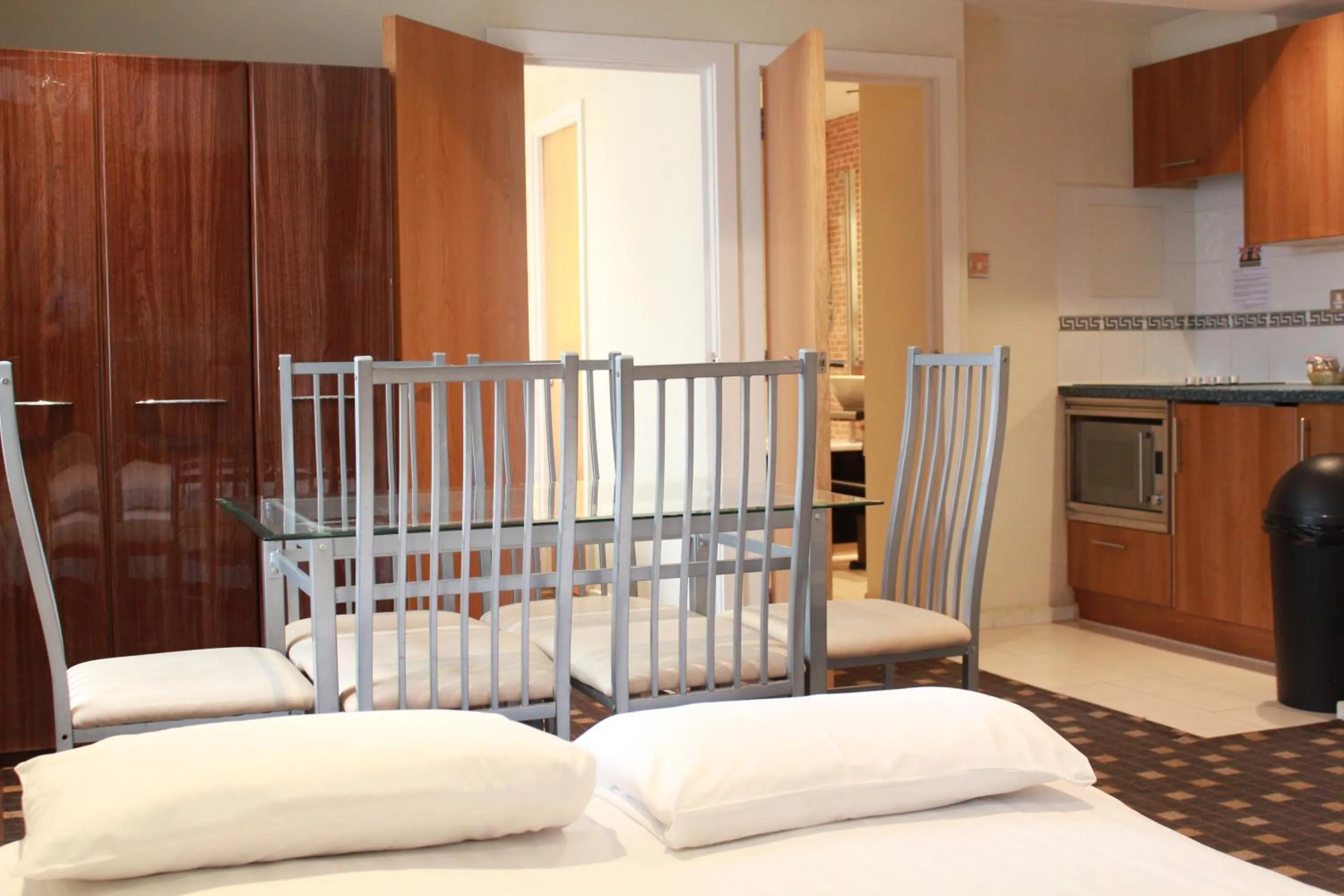 Kitchen or kitchenette, Bed in Grand Plaza Serviced Apartments