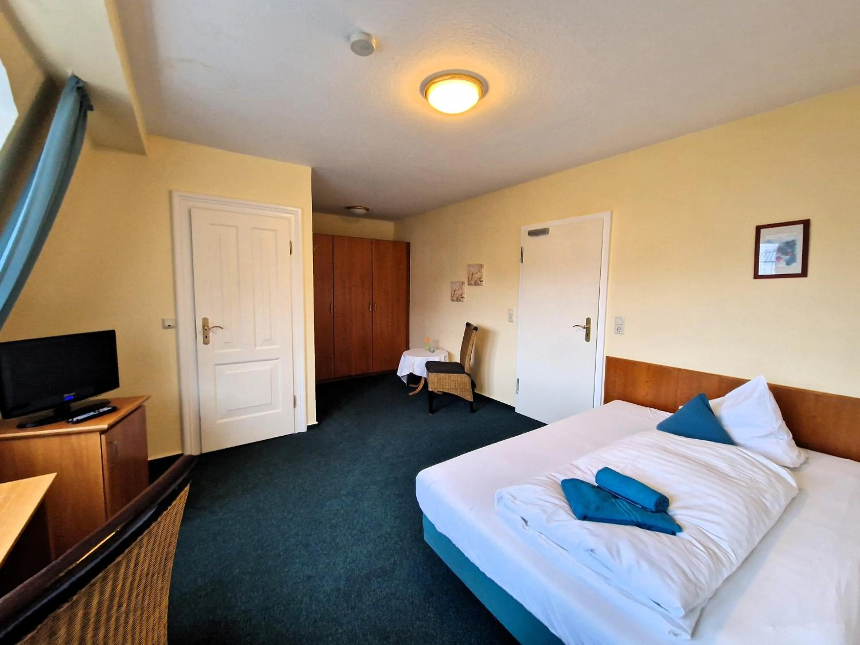 Photo of the whole room, Bed in Hotel Fährhaus Niederkleveez