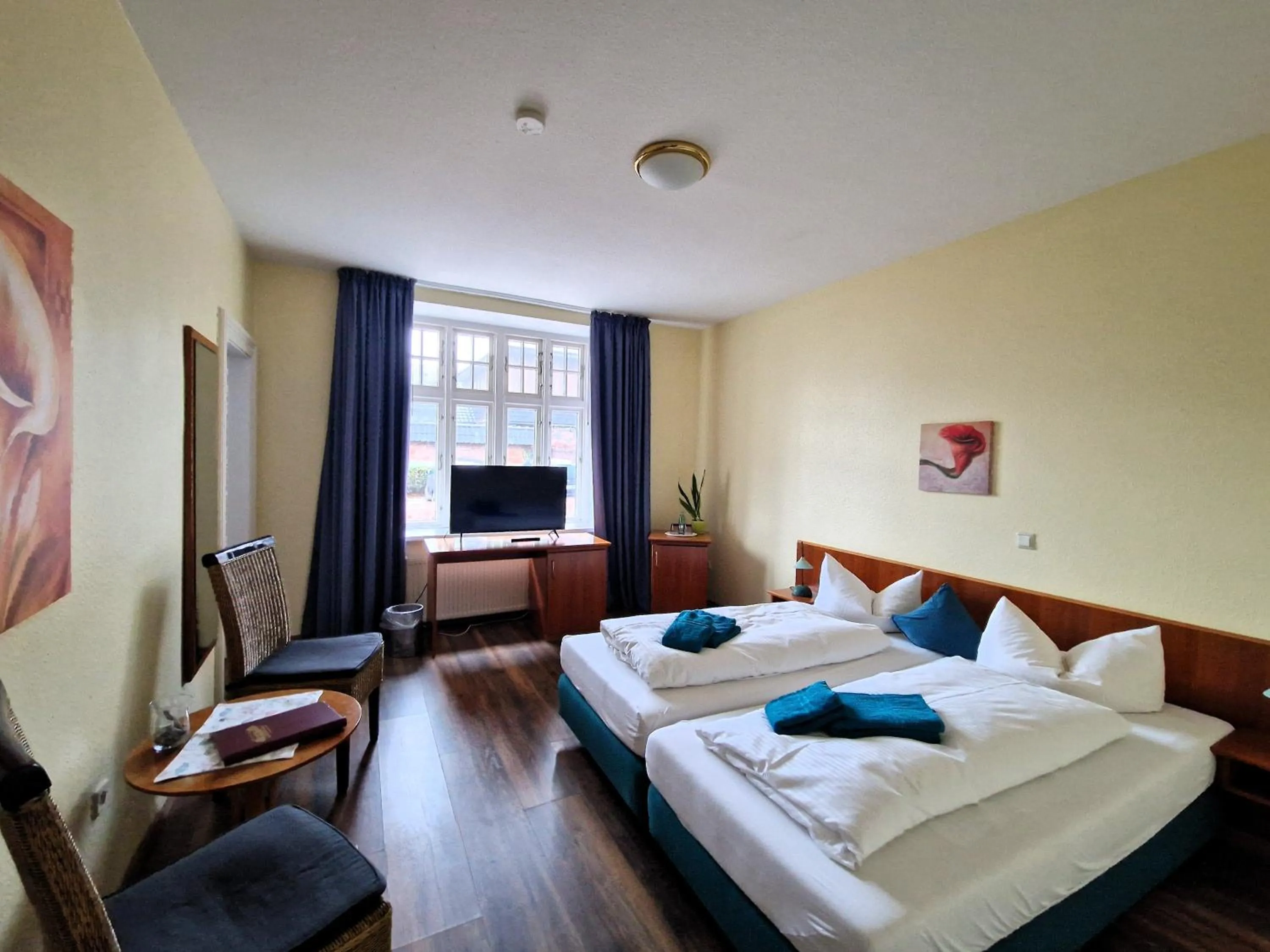 Photo of the whole room, Bed in Hotel Fährhaus Niederkleveez