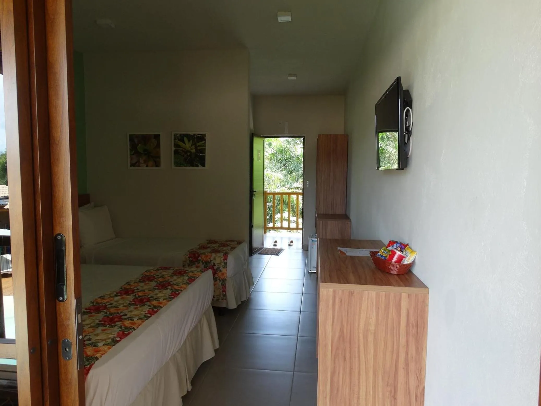 Bed in Pousada Tropicarim