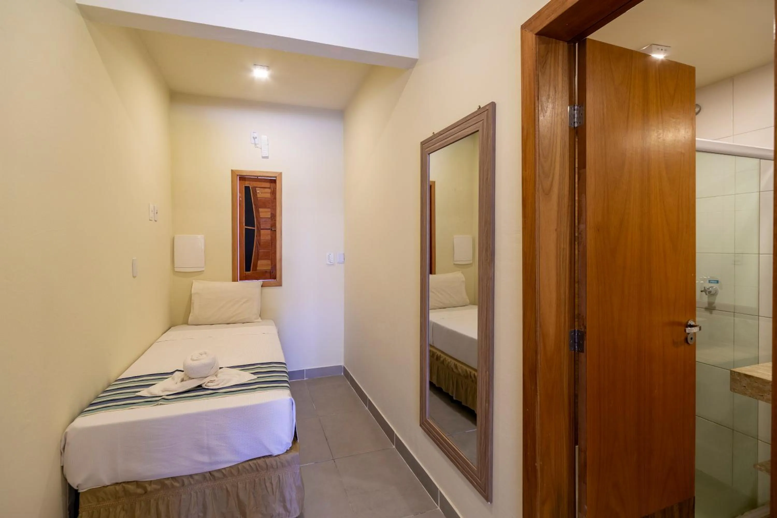 Bed in Pousada Tropicarim