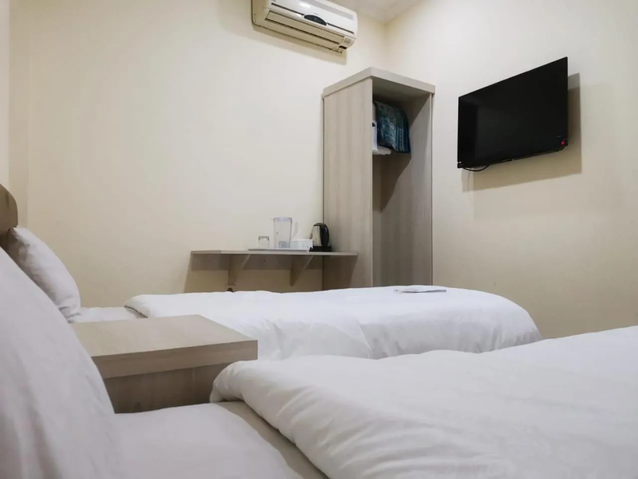 Bed in Hotel Nusantara Indah Syariah