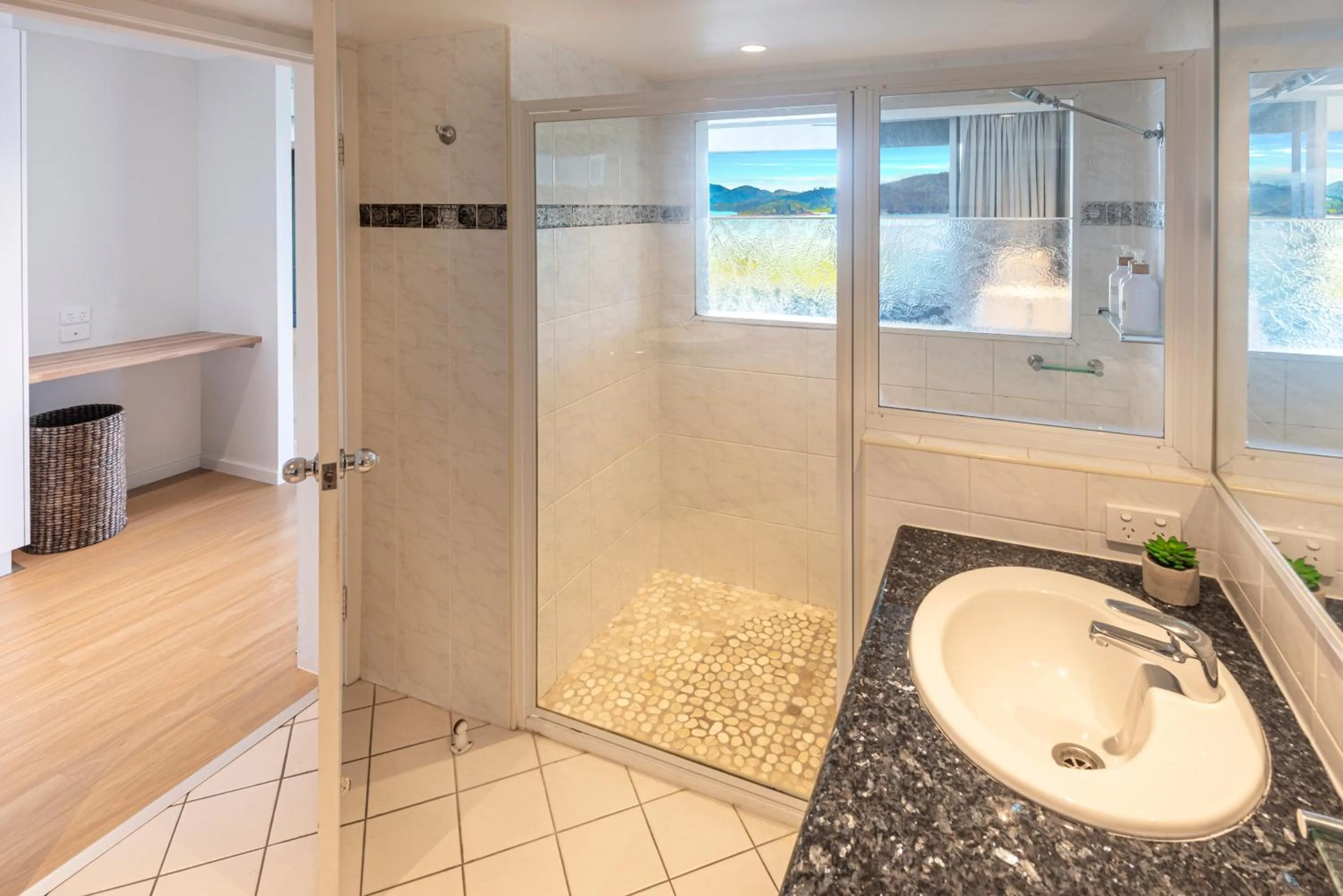Shower in Lagoon Beachfront Lodge 202 on Hamilton Island by HamoRent