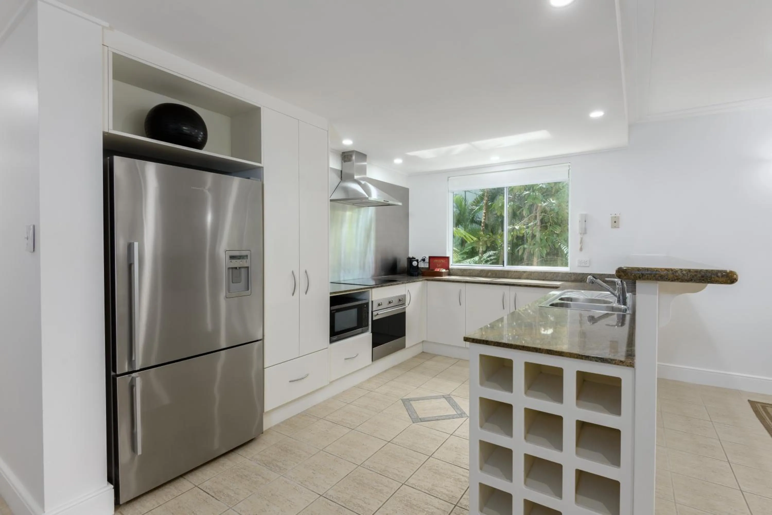 Kitchen or kitchenette in Mandalay Luxury Beachfront Apartments