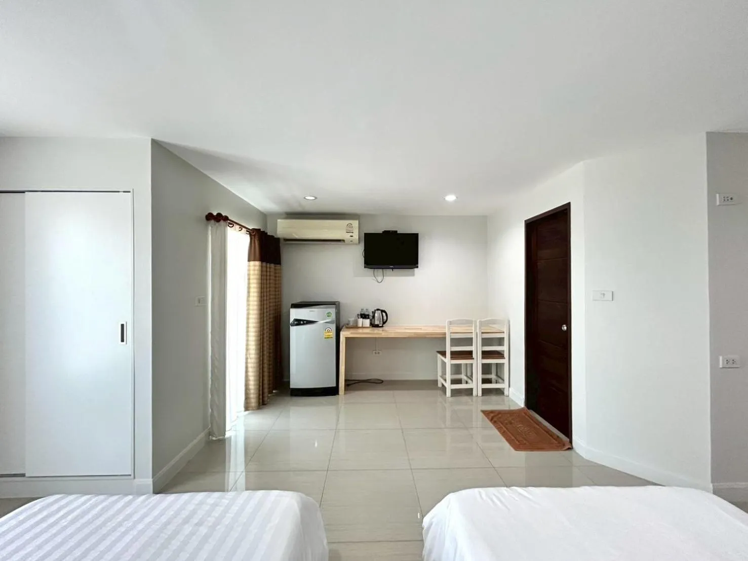 Bed in DD Boutique Resort