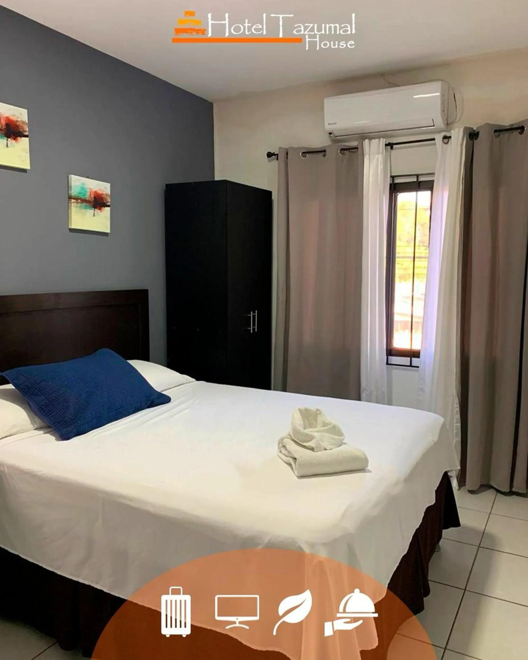 Bed in Hotel Tazumal House