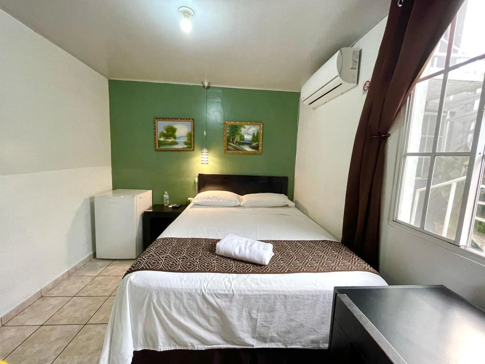 Bed in Hotel Tazumal House