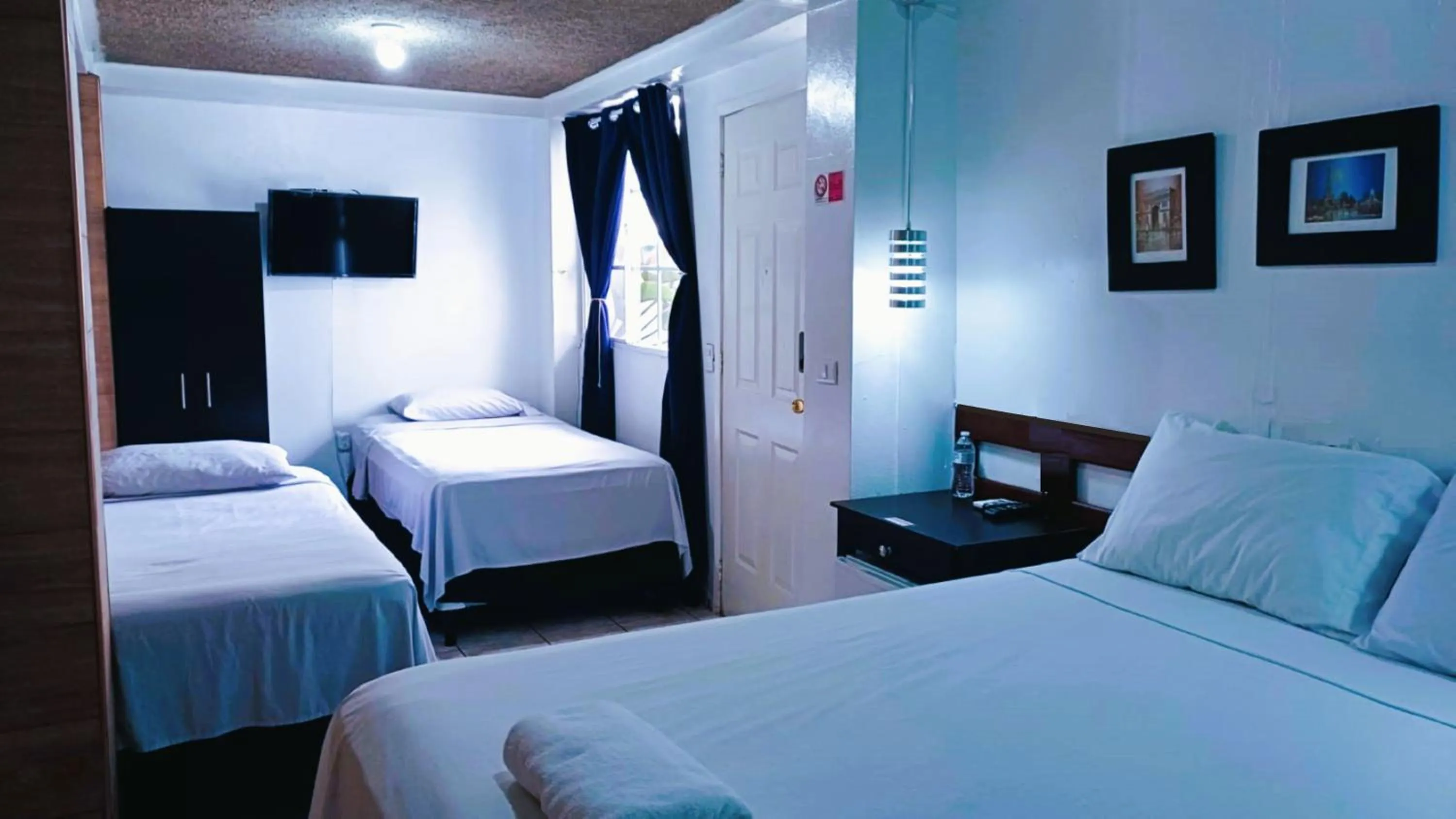 Bed in Hotel Tazumal House