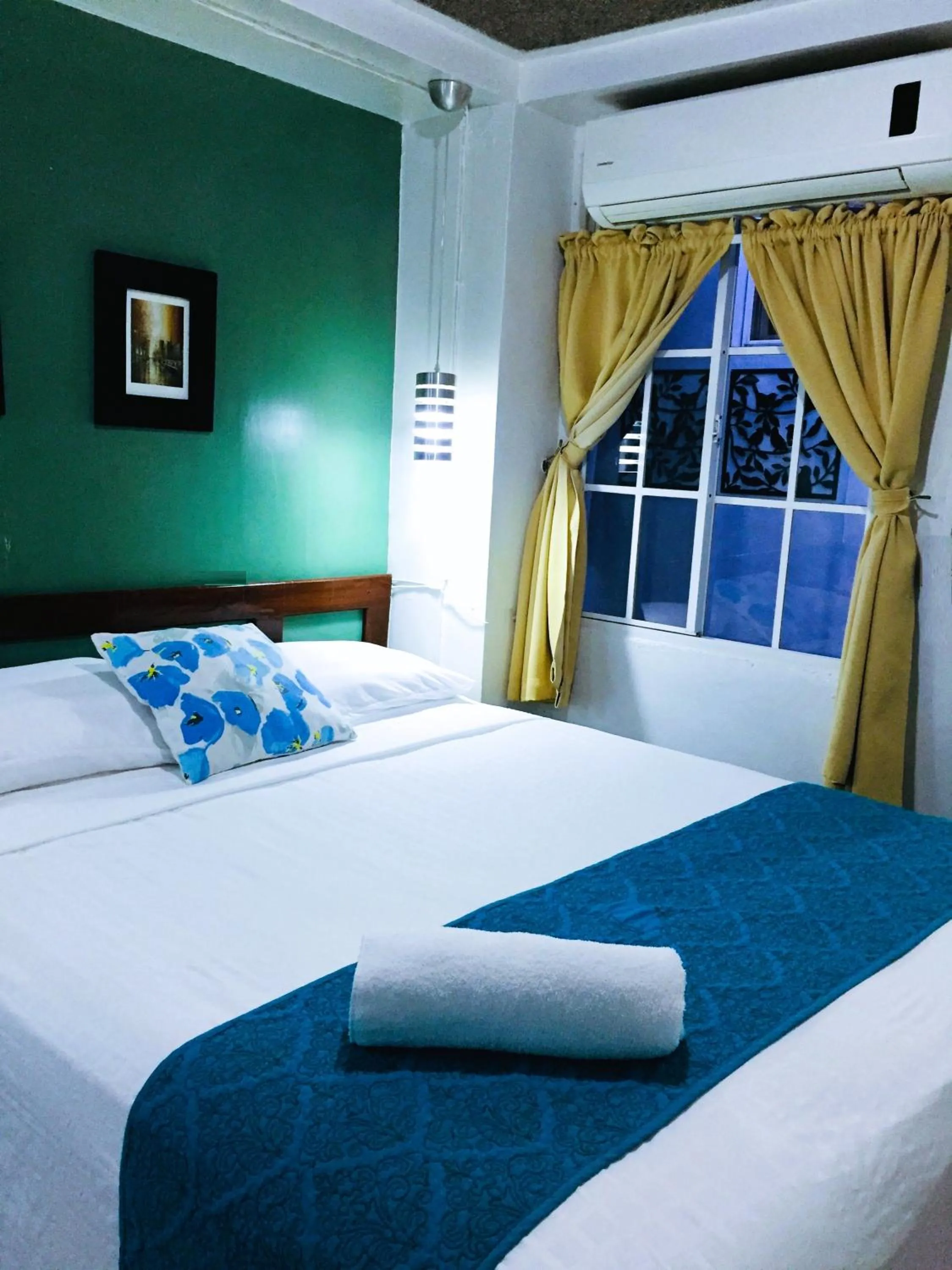 Bed in Hotel Tazumal House