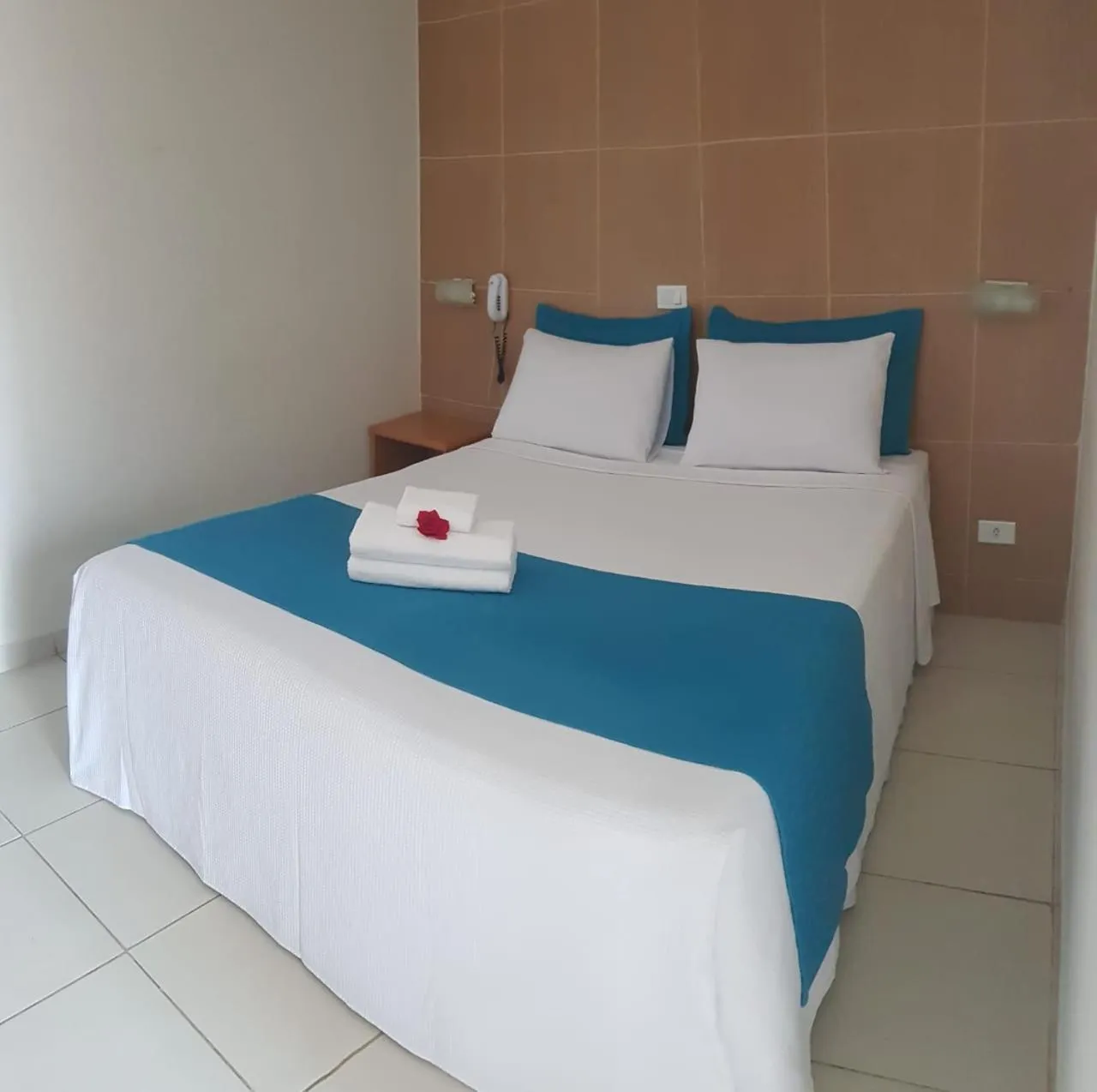 Bed in Pousada Maragolfinho