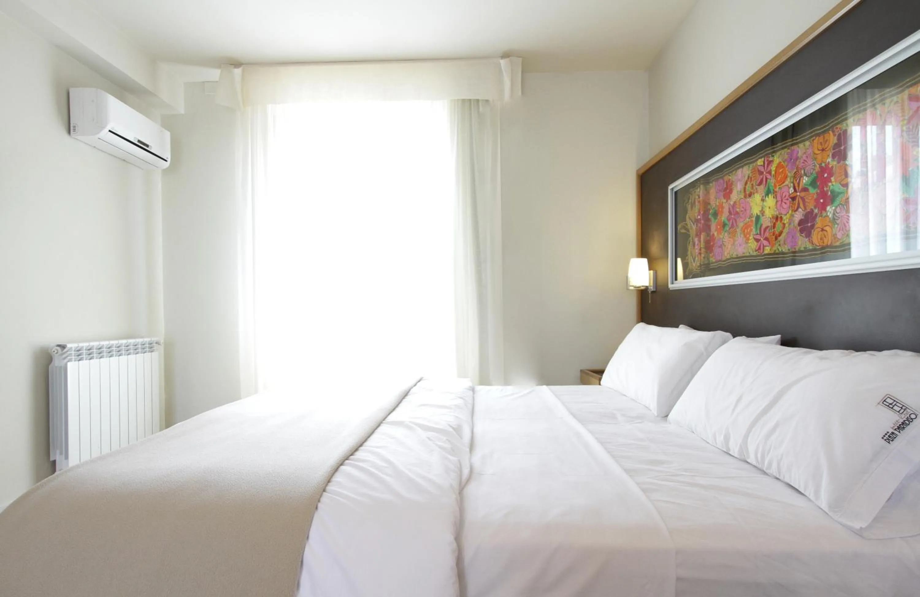 Bed in Plaza Paradiso Petit Hotel