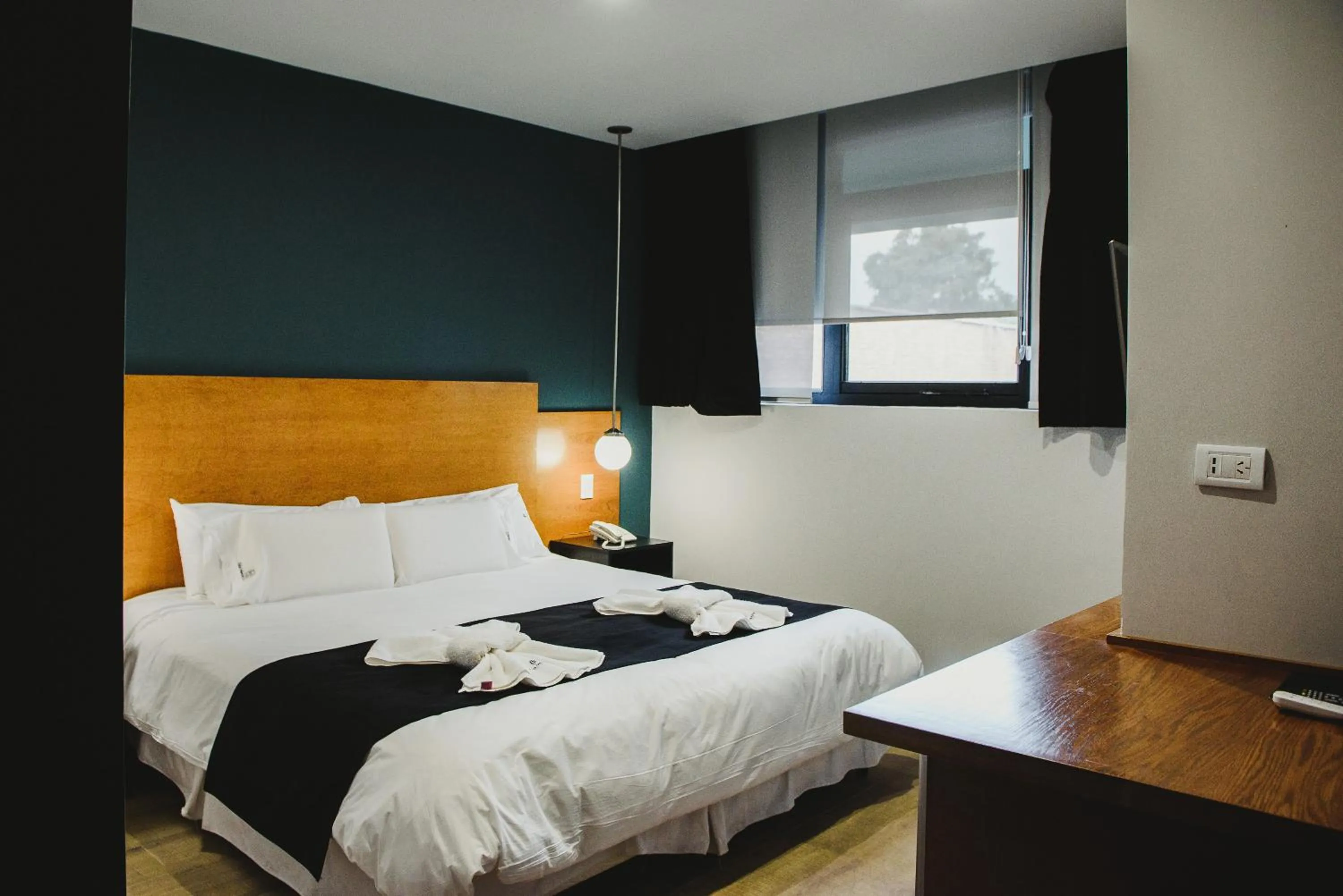 Bed in Plaza Paradiso Petit Hotel