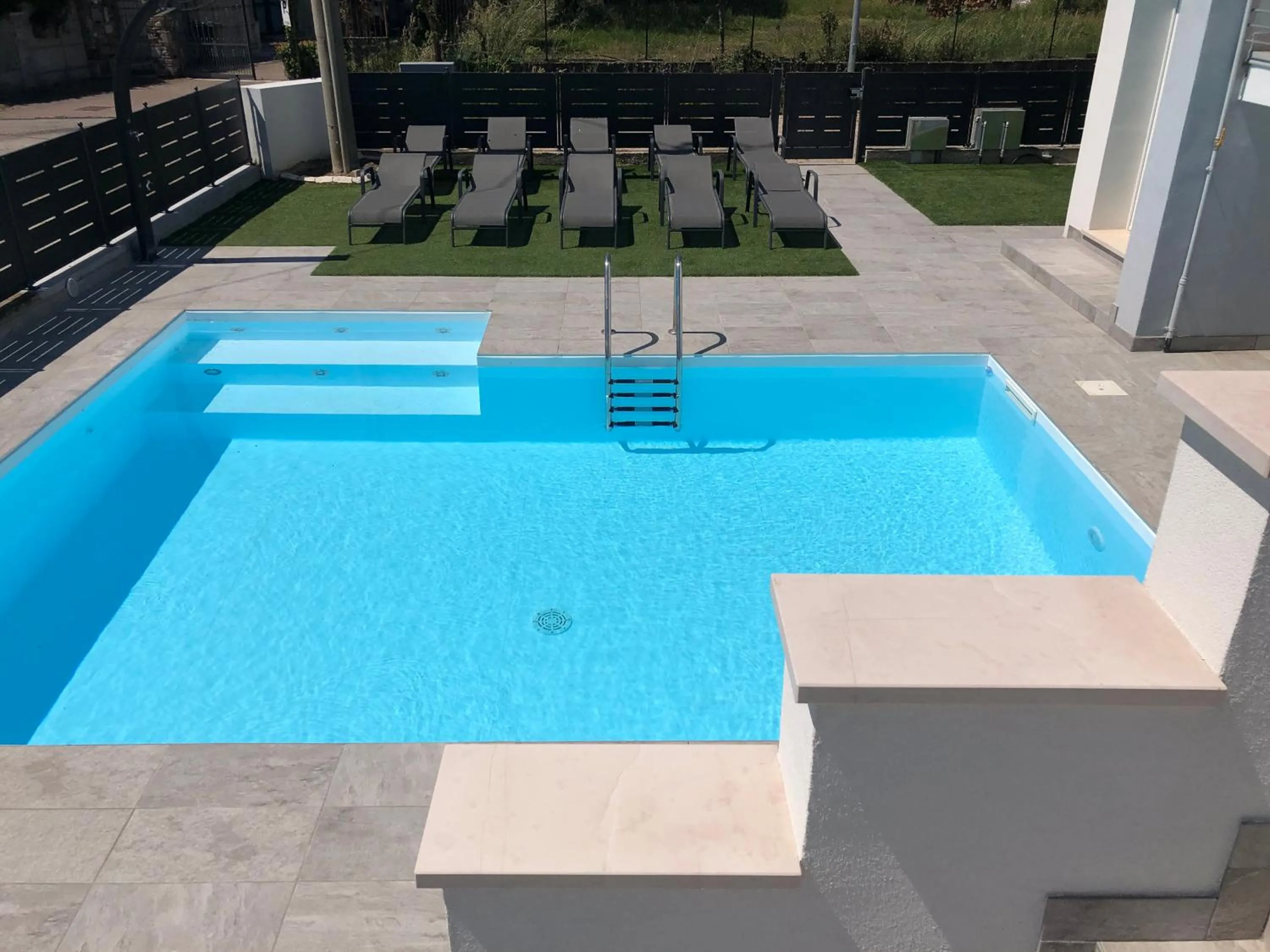 Swimming pool in B&B Alma Garda Lake