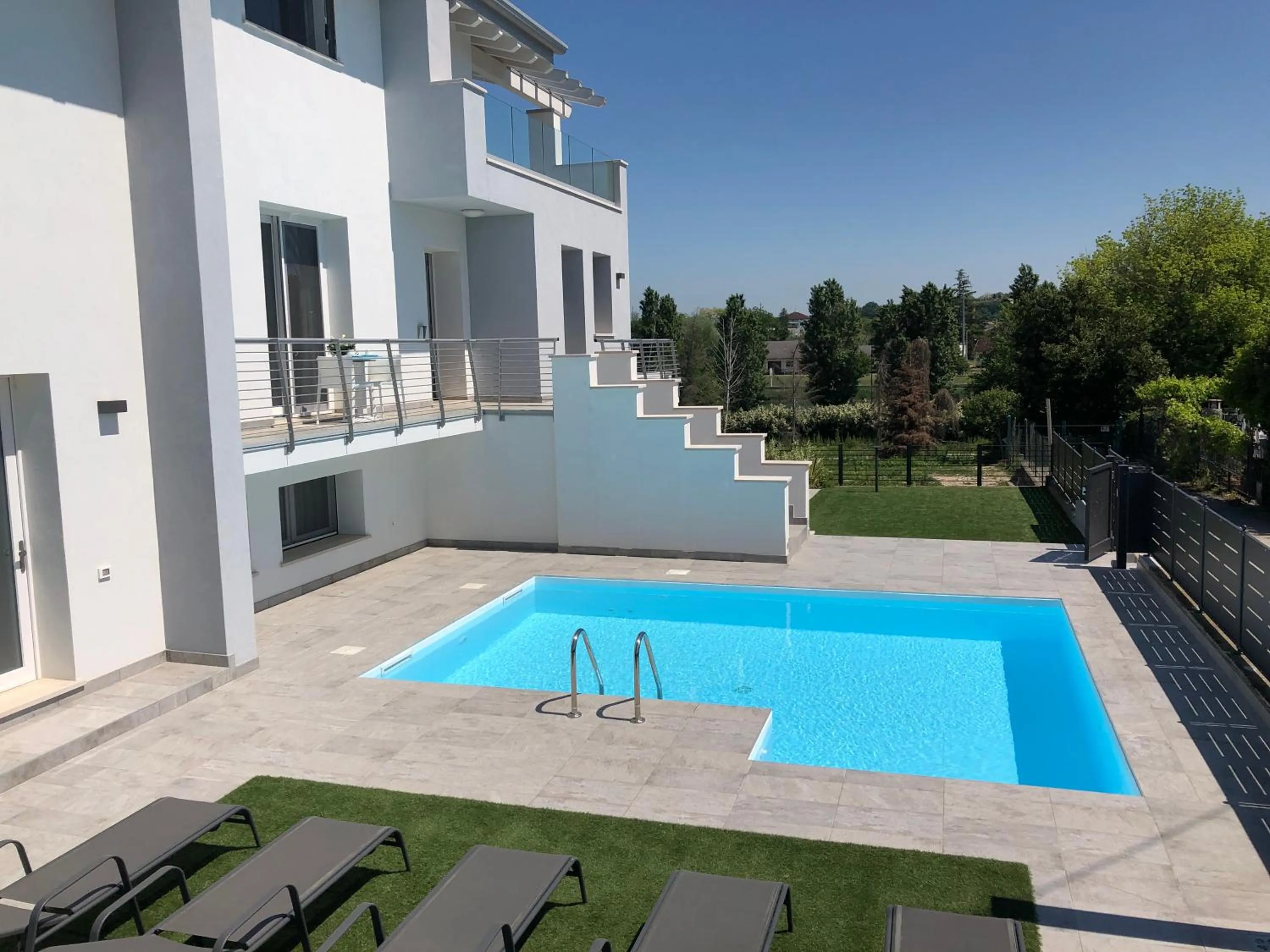 Pool view in B&B Alma Garda Lake