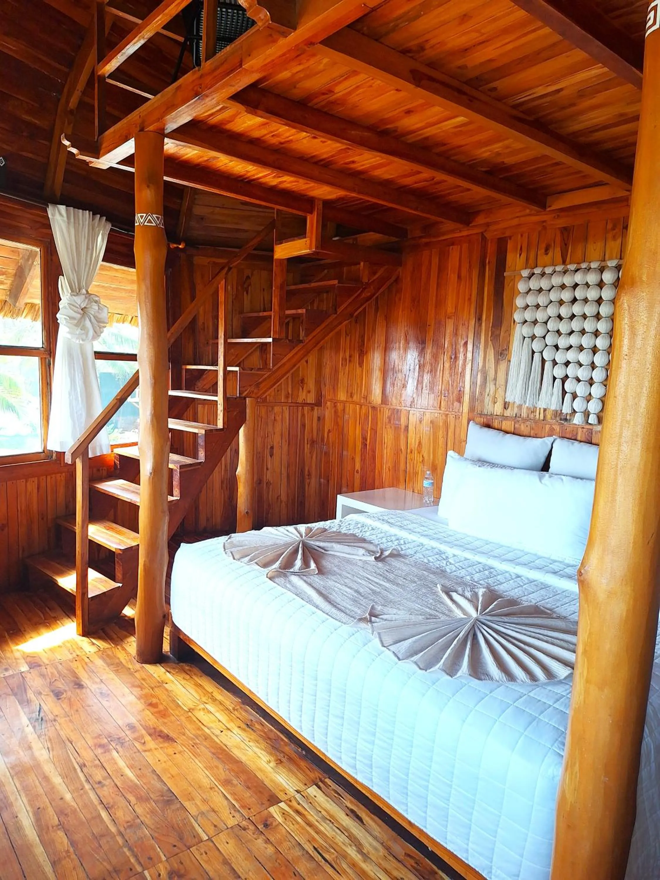 Bed in Hotel Tortuga Village