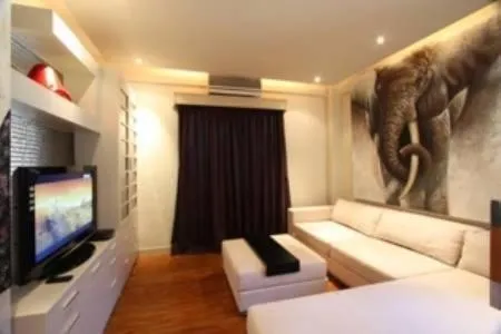 Living room, Bed in Sejuk Suites