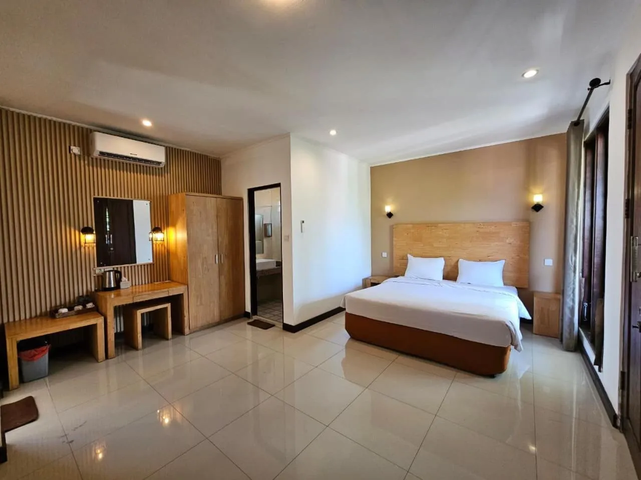 Bed in Nipuri Resort and Villas Seminyak by Kamara