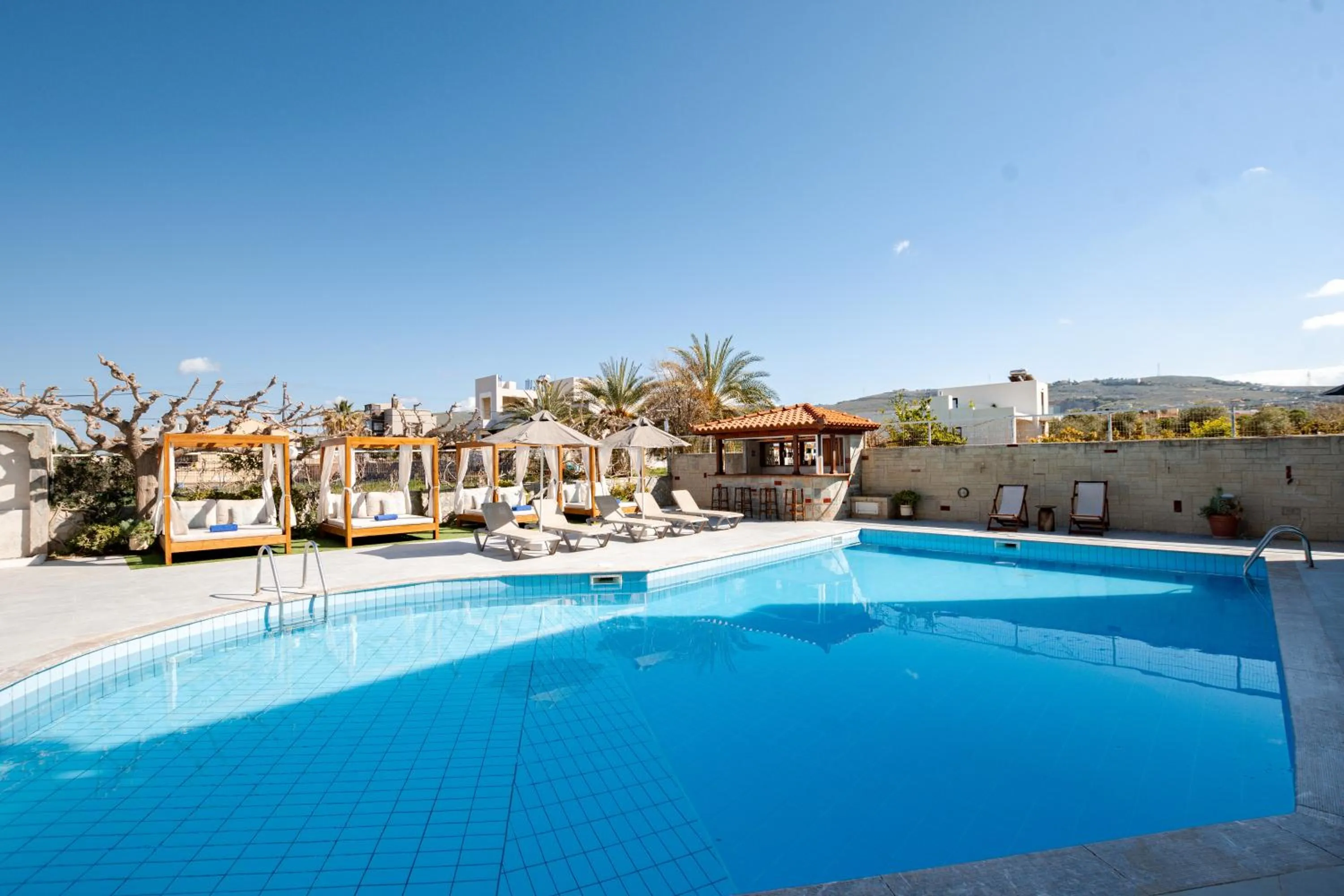 Swimming pool in Dimitra Hotel & Apartments by Omilos Hotels