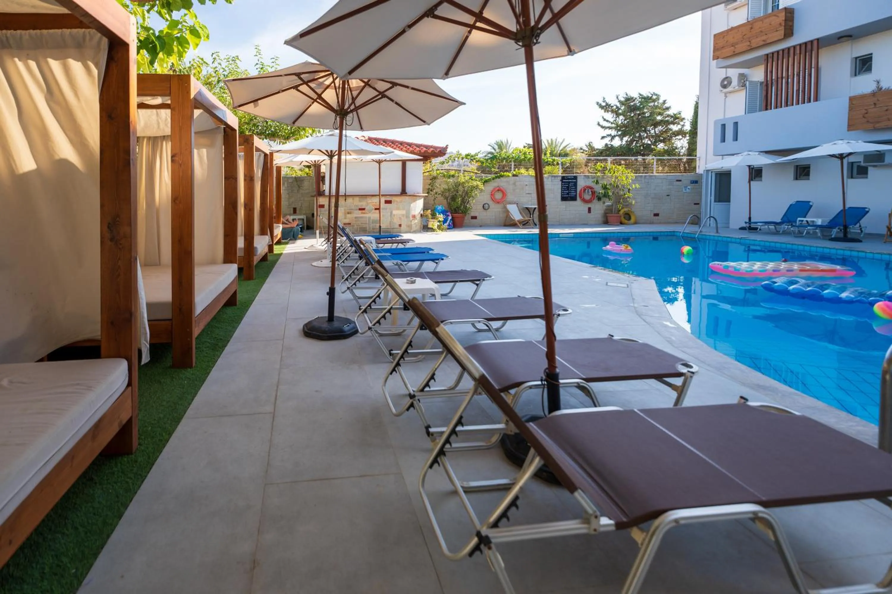 Swimming pool in Dimitra Hotel & Apartments by Omilos Hotels