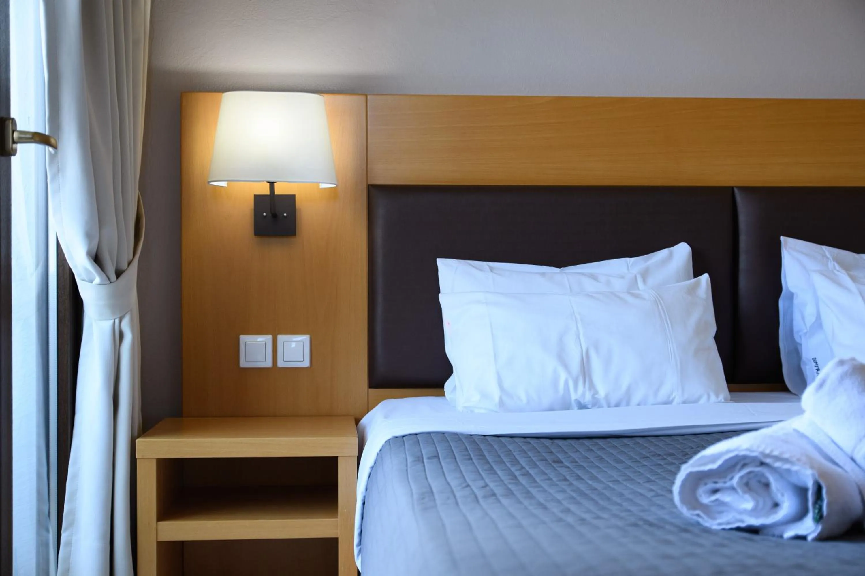 Bed in Dimitra Hotel & Apartments by Omilos Hotels
