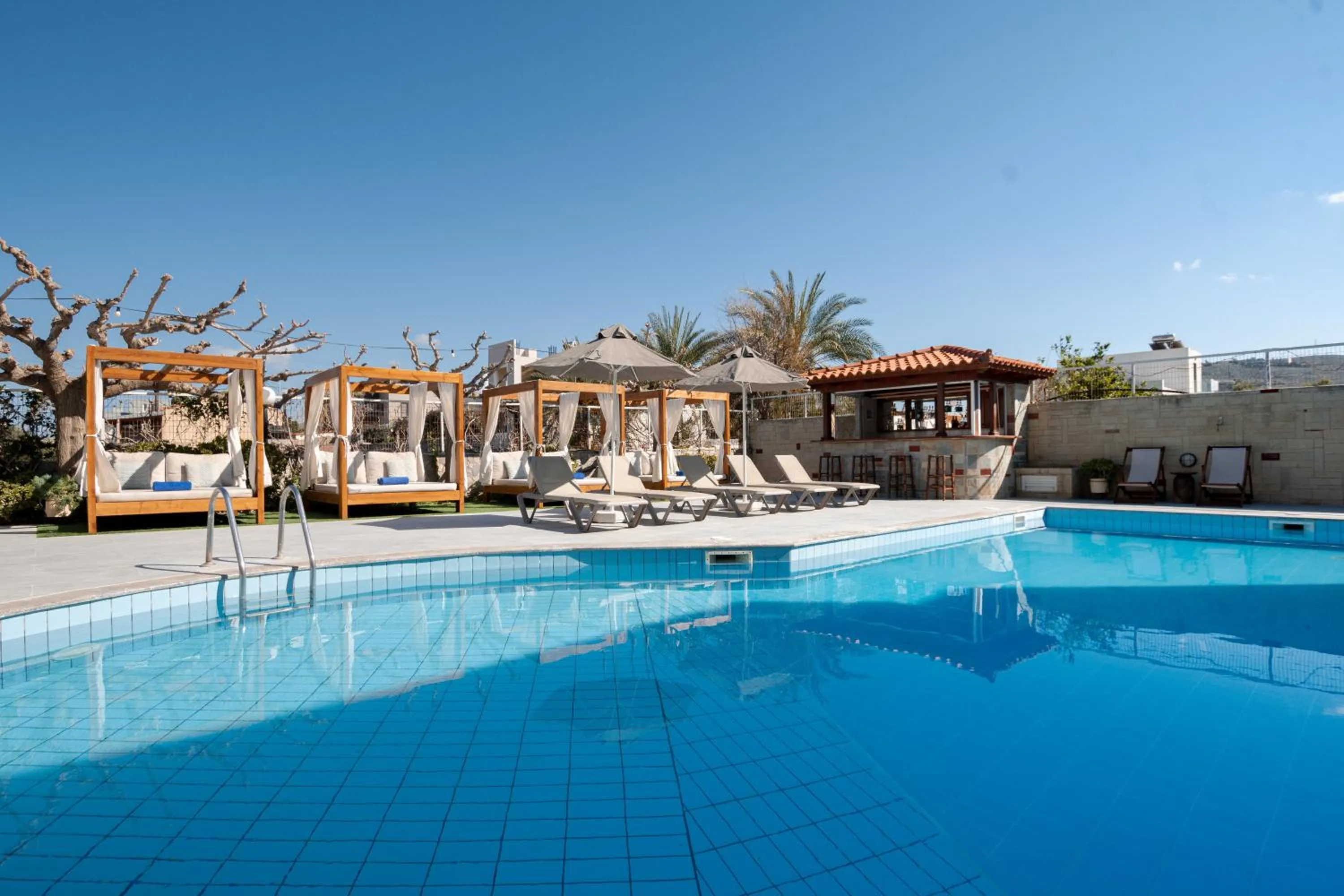 Swimming pool in Dimitra Hotel & Apartments by Omilos Hotels