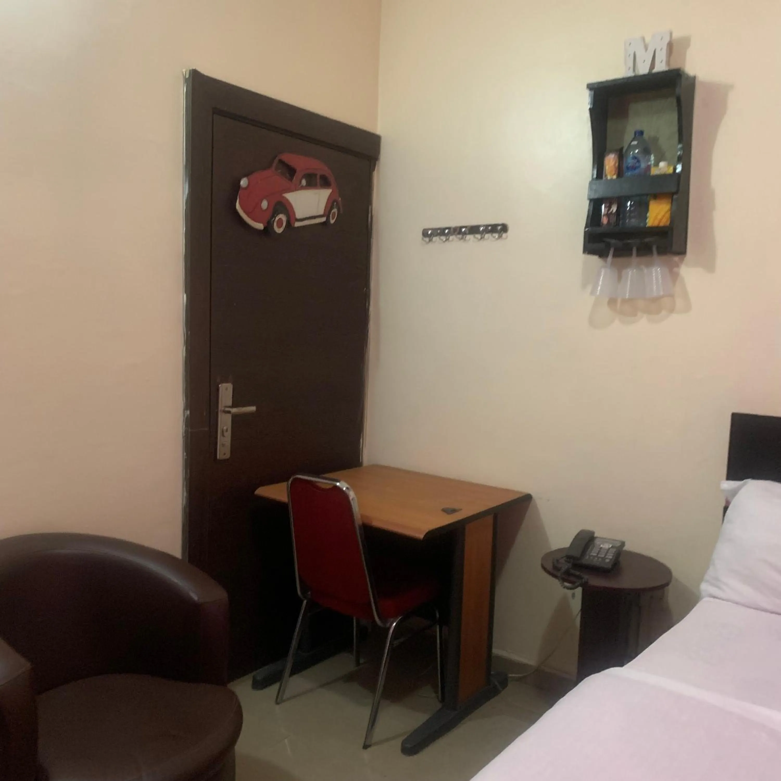 Seating area, Bed in Health Plaza Abuja