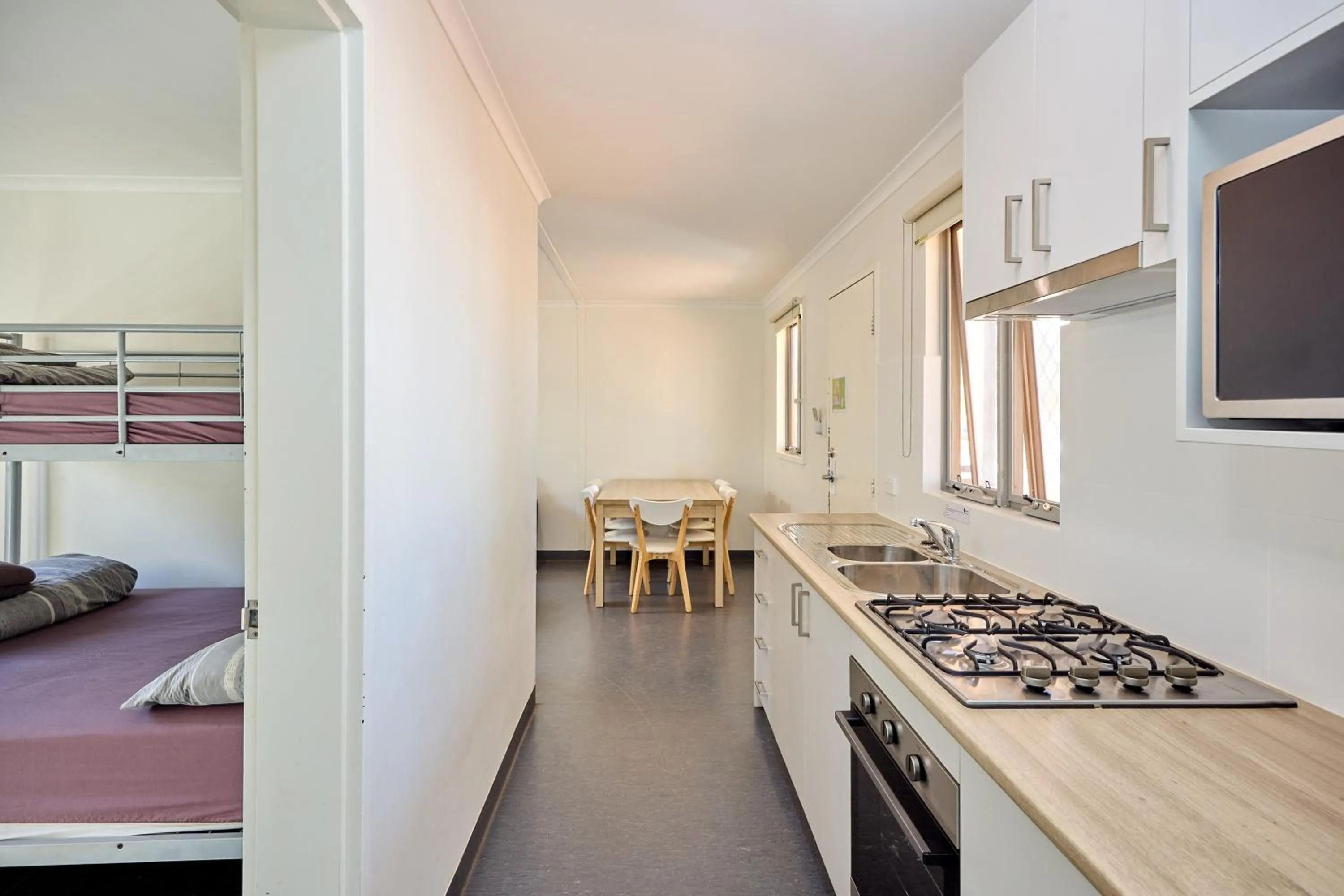 Kitchen or kitchenette, Bed in RAC Exmouth Cape Holiday Park