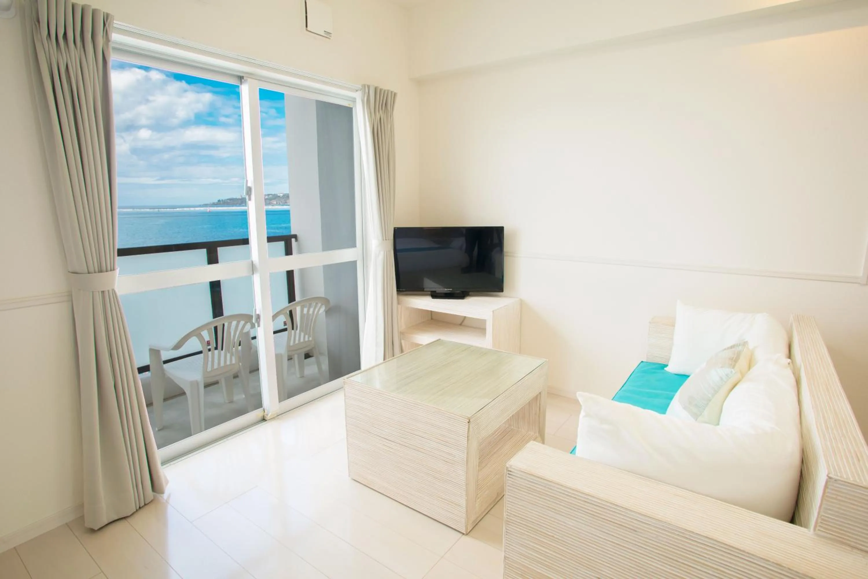 Living room, Bed in Costa Bella Condominium Resort