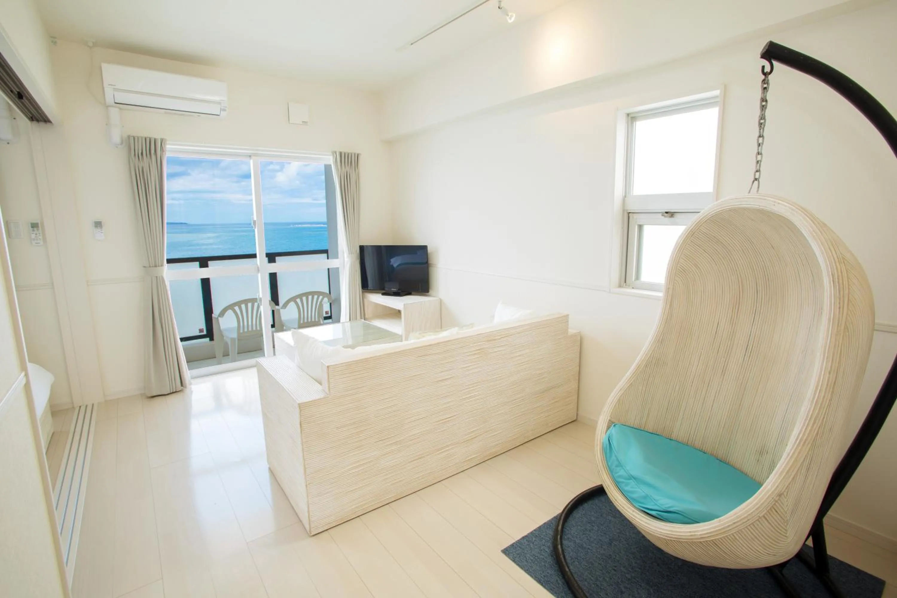 Living room, Bed in Costa Bella Condominium Resort