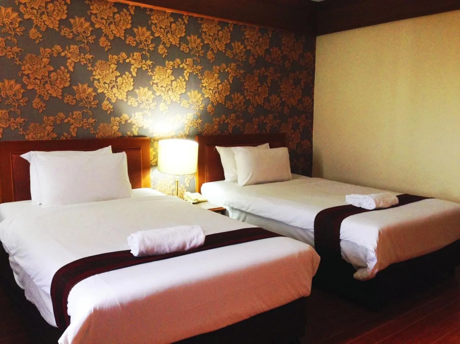 Bed in JP Emerald Hotel