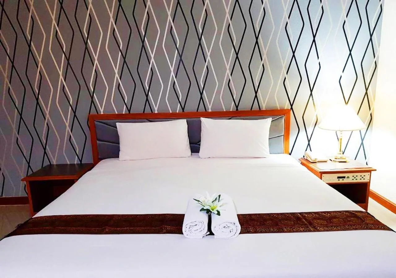 Bed in JP Emerald Hotel