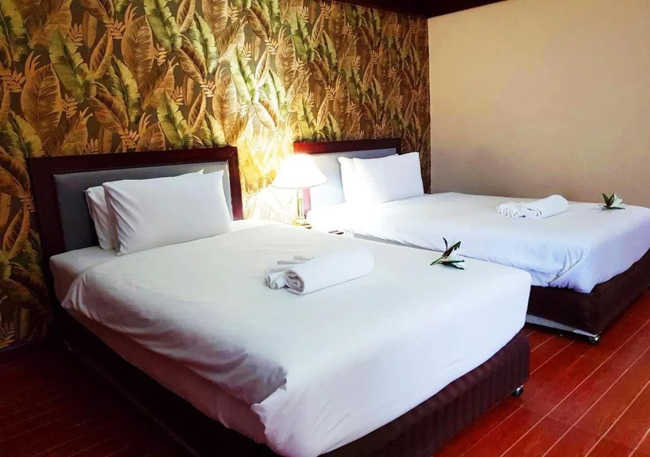 Bed in JP Emerald Hotel