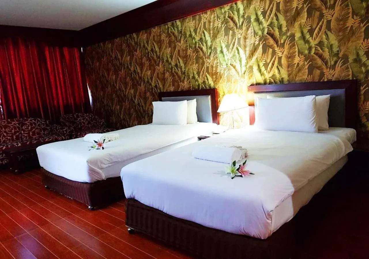 Bed in JP Emerald Hotel