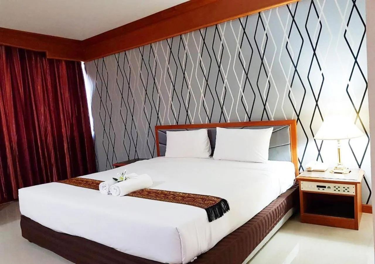 Bed in JP Emerald Hotel