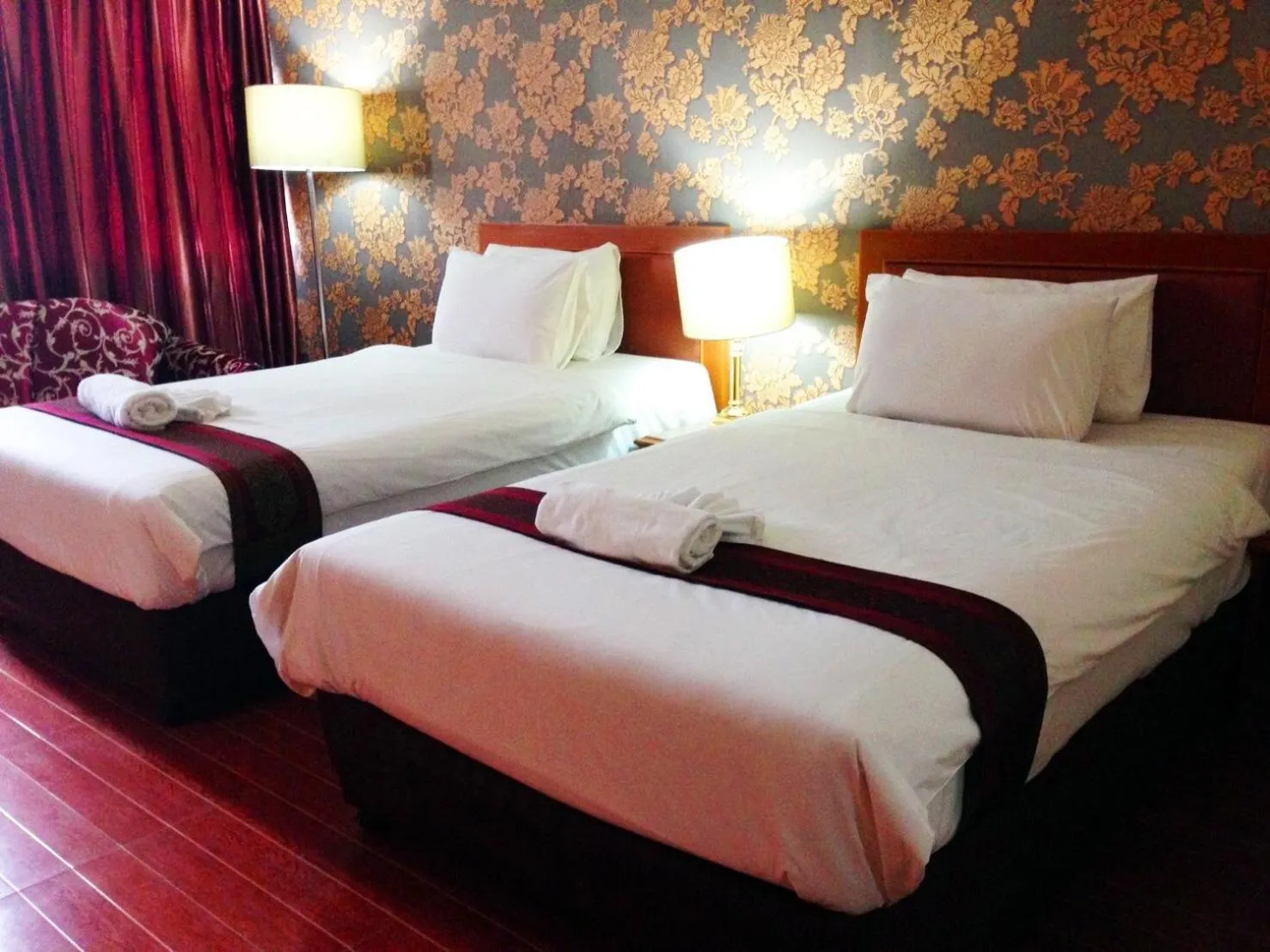 Bed in JP Emerald Hotel