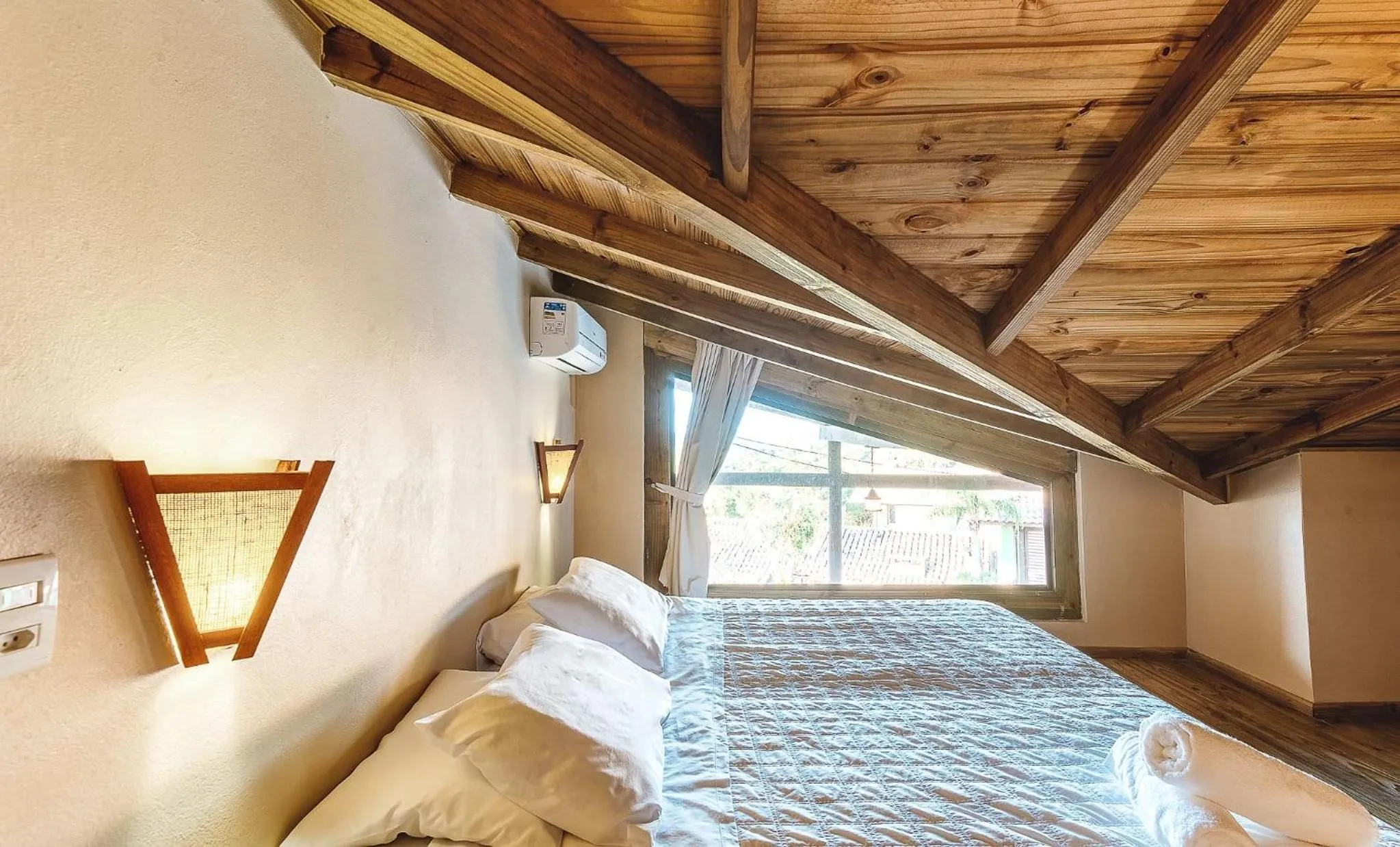 Bed in Pousada Bangalôs do Rosa