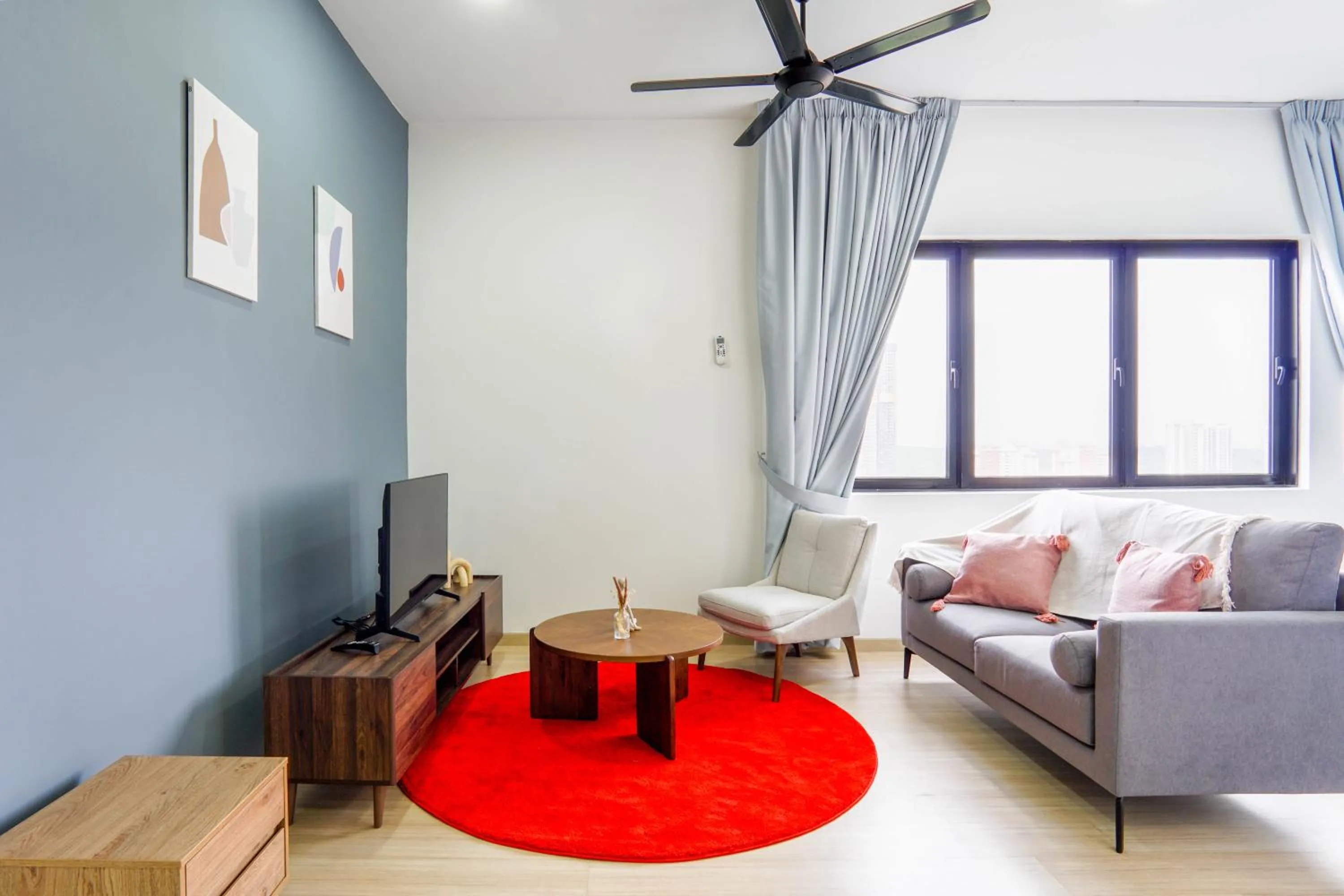 Living room in Encorp Strand Residences by Airhost