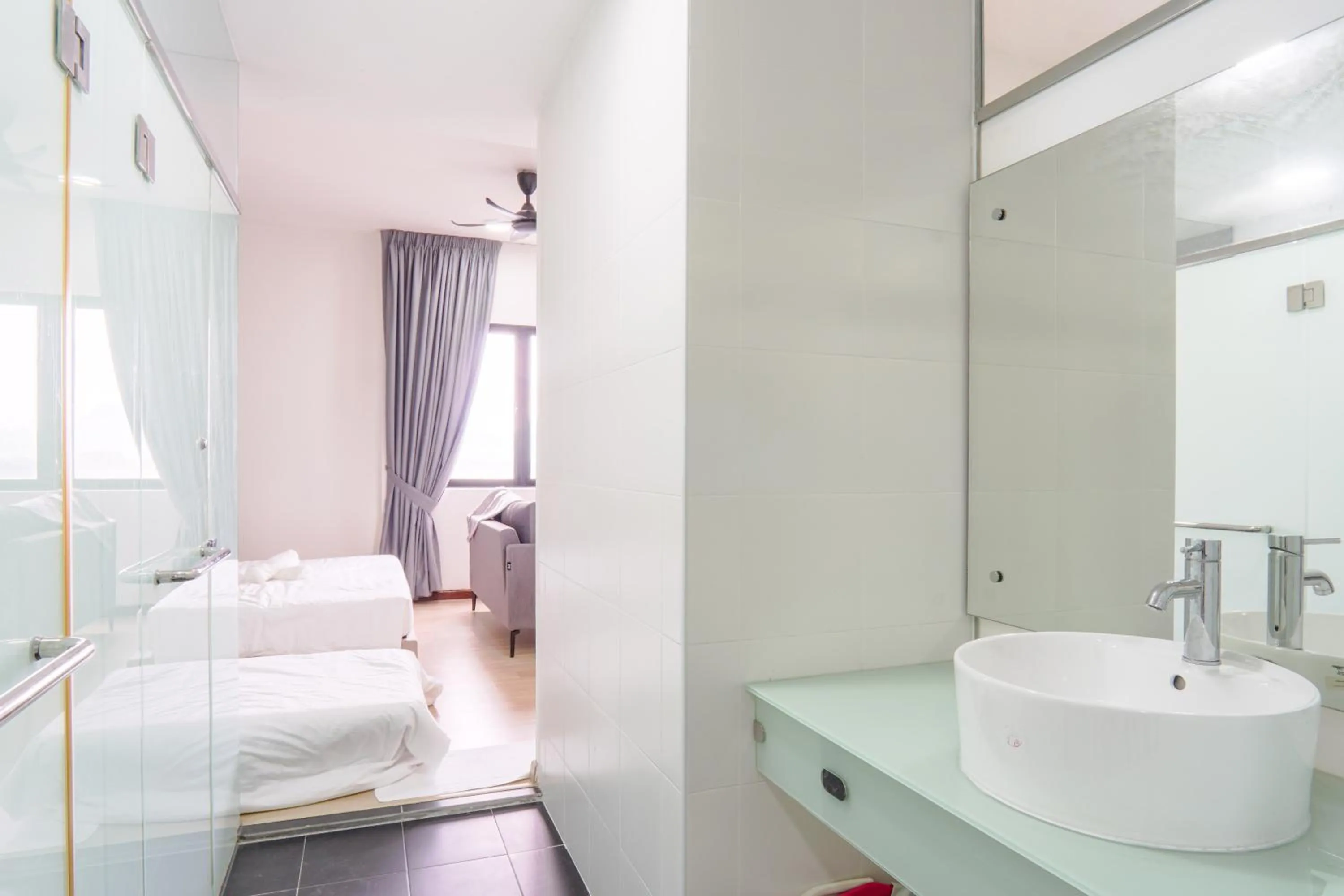 Bathroom, Bed in Encorp Strand Residences by Airhost