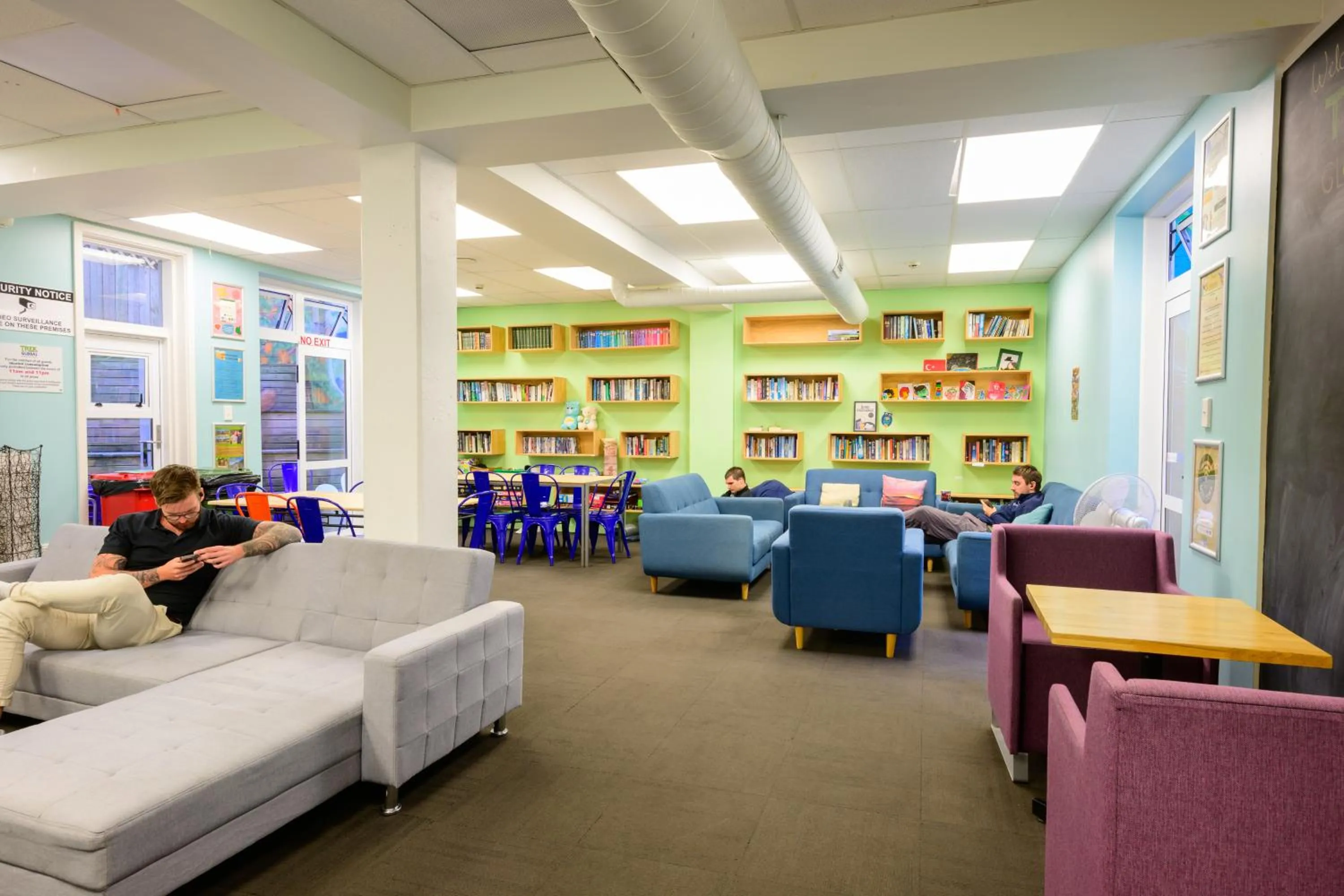 Communal lounge/ TV room in Trek Global Backpackers