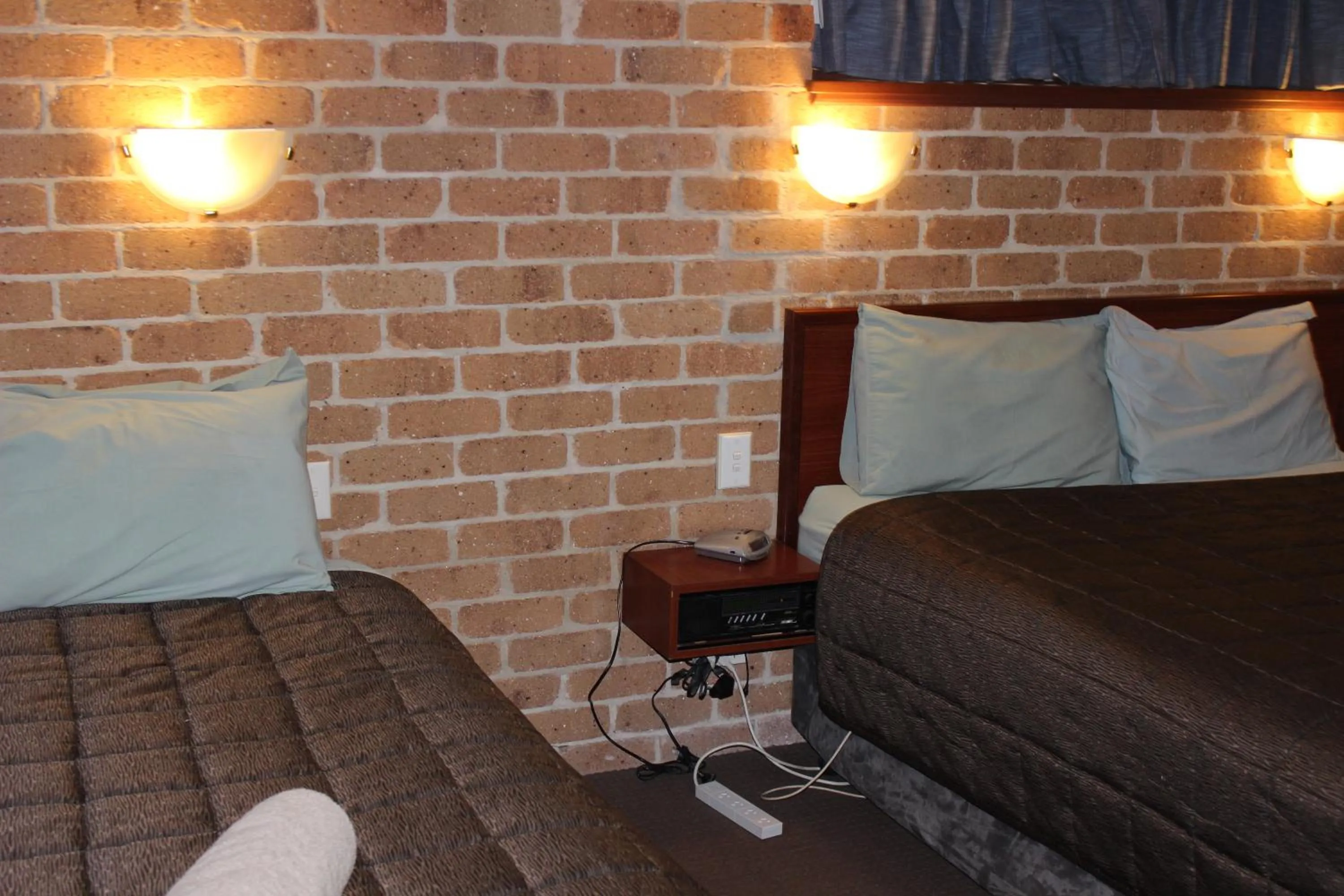 Bed in Acacia Motor Inn