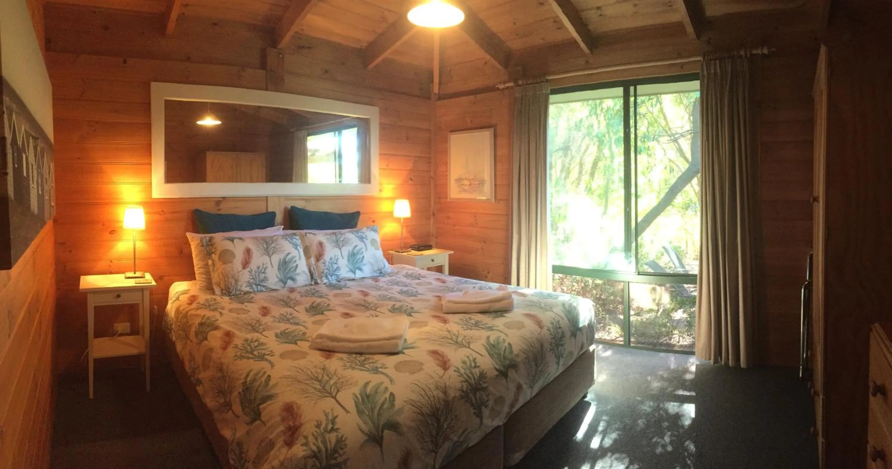Bed in Sandpiper Ocean Cottages