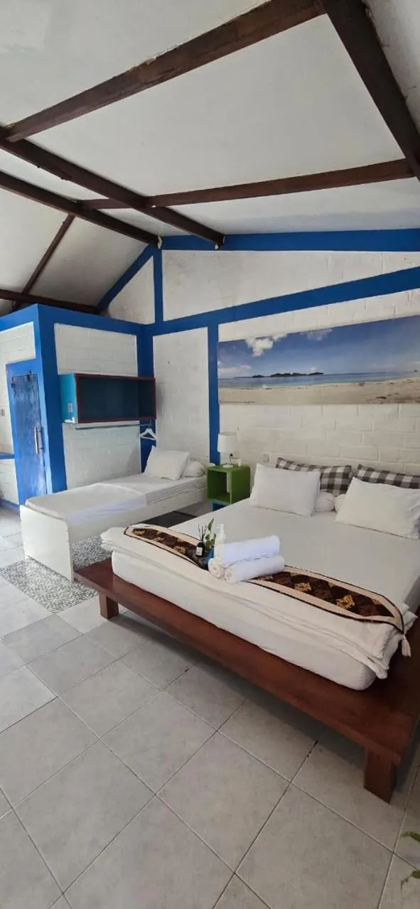 Bed in Omah Alchy Cottages