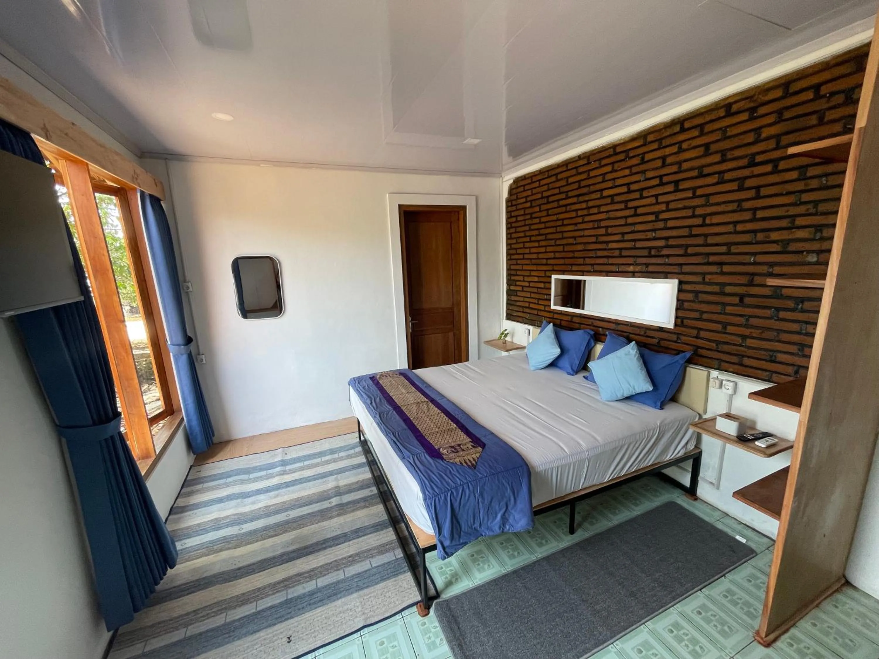 Bed in Omah Alchy Cottages