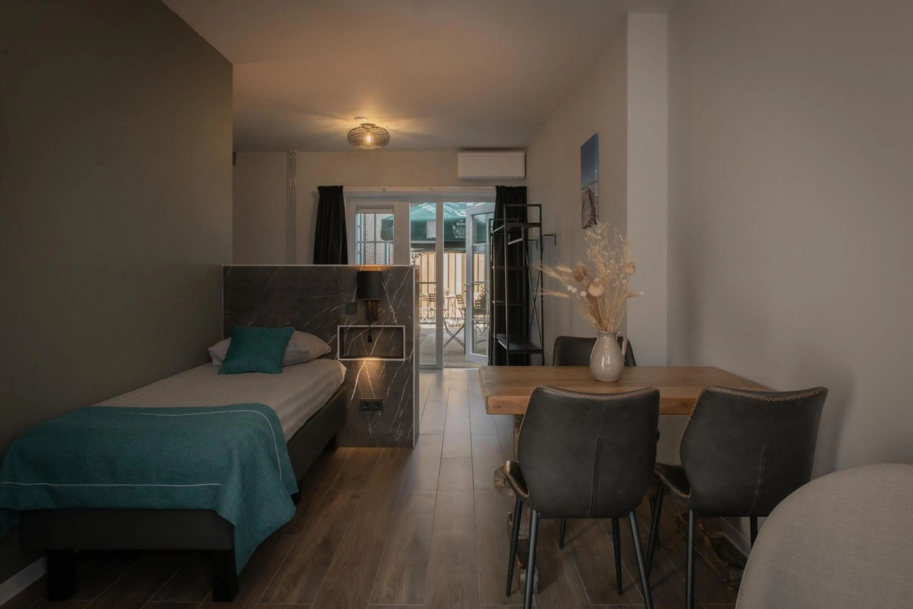 Seating area, Bed in Hotel Groede